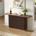 Anthony & Home console table with ash veneer top, fluted base, and metal accents, from the Studio Collection.