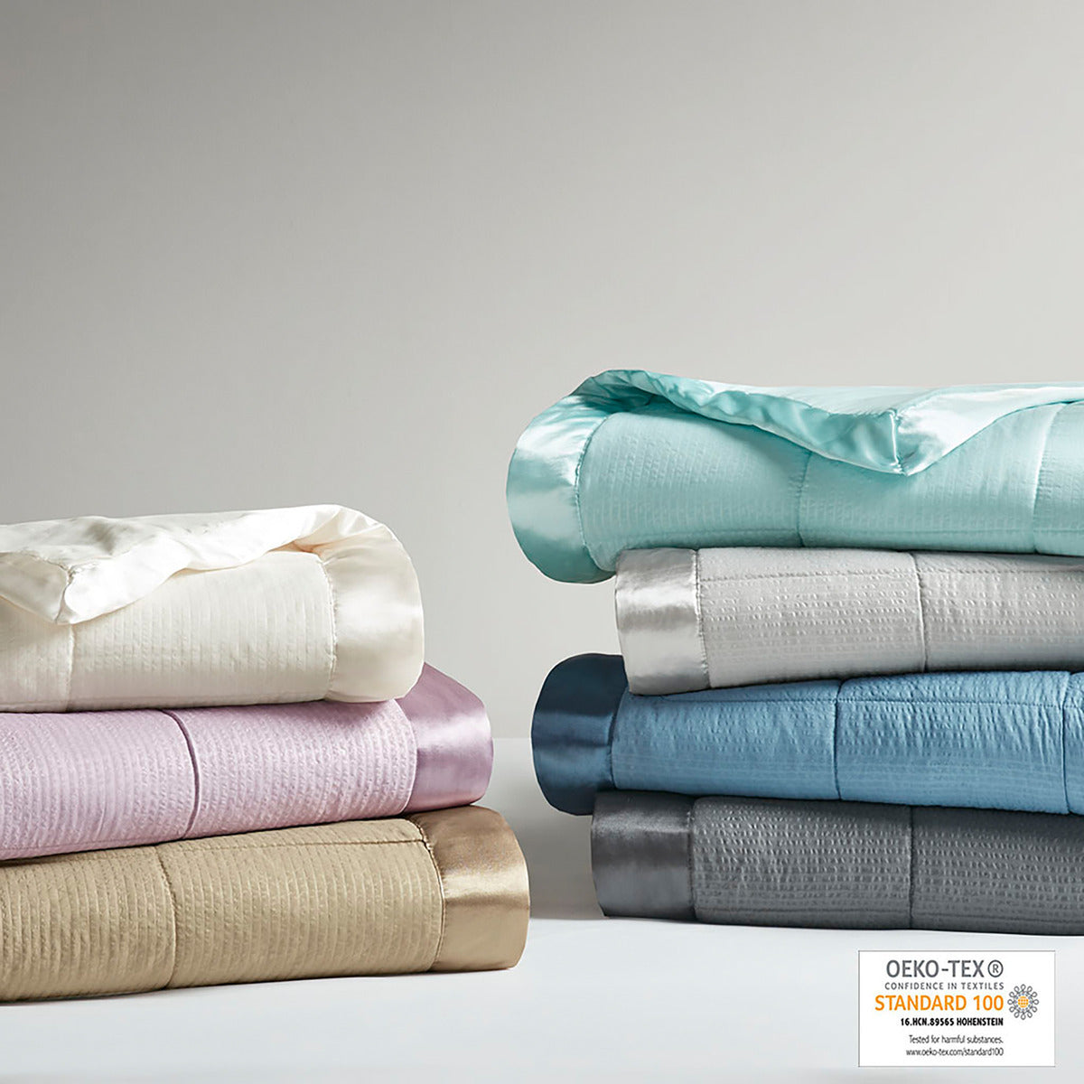Taupe satin-trim oversized king blanket by Anthony & Home, showing soft, luxurious fabric and elegant satin edging.