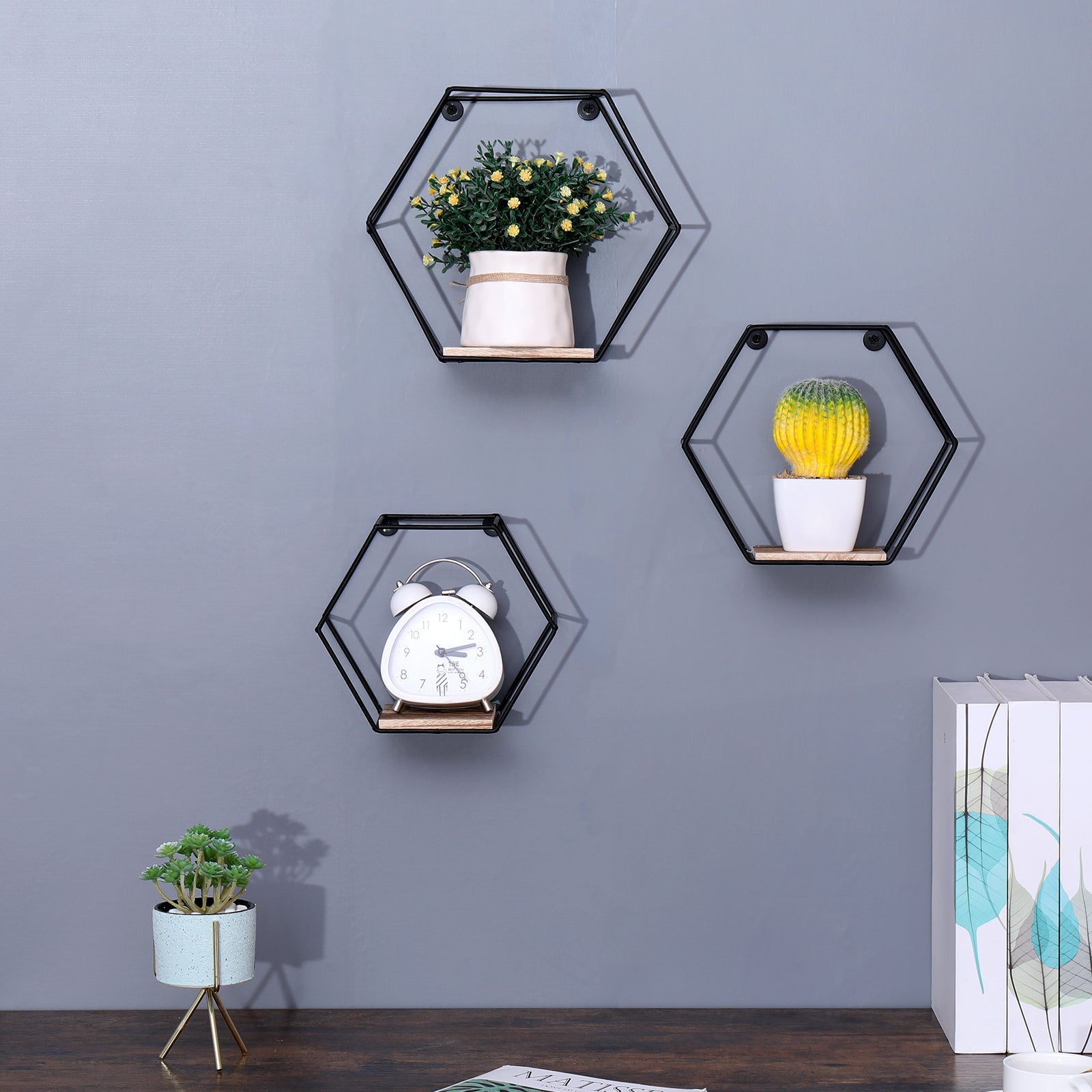 Set of three natural wood hexagonal floating shelves by Anthony & Home, wall-mounted for modern storage and display.