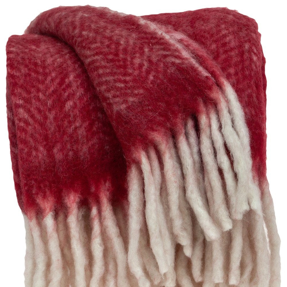 Red woven acrylic reversible throw blanket from HomeRoots, displaying a textured solid color design on both sides.