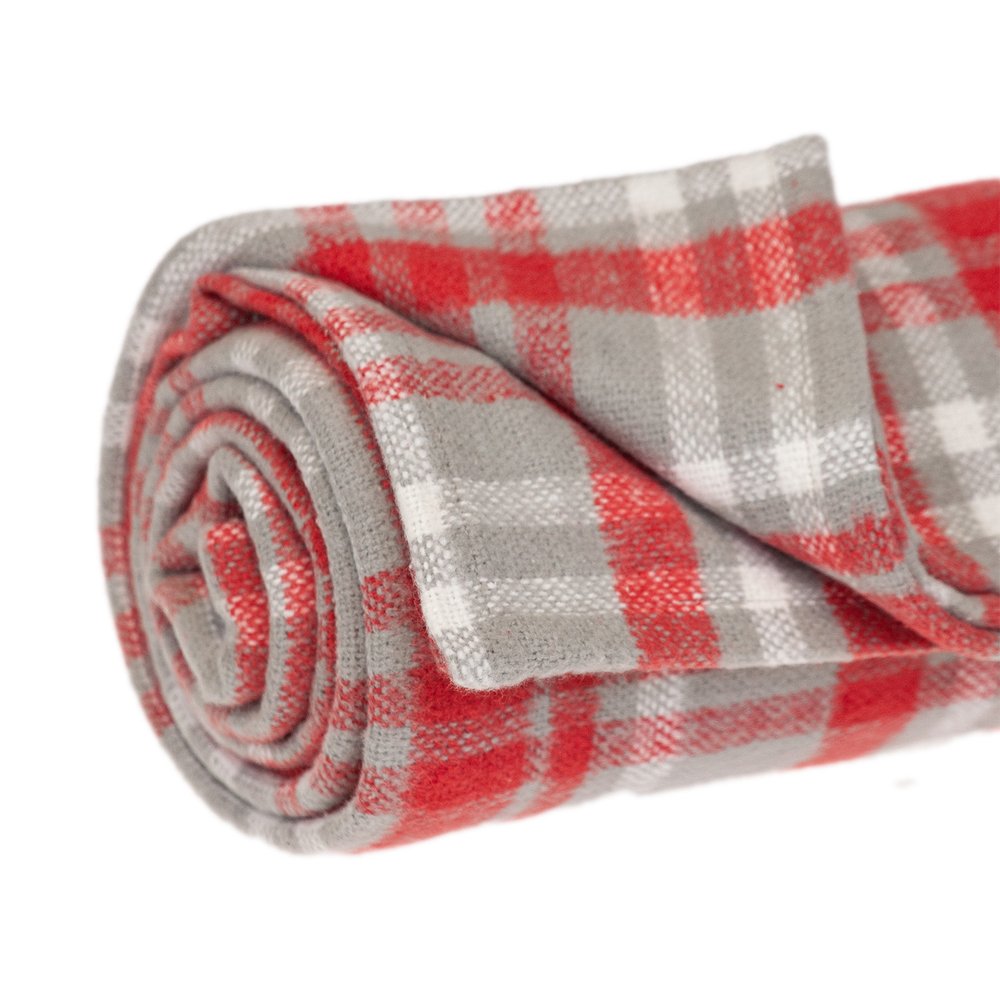 Red woven cotton plaid throw blanket by HomeRoots, showing soft fabric with a classic plaid pattern and fringed edges.
