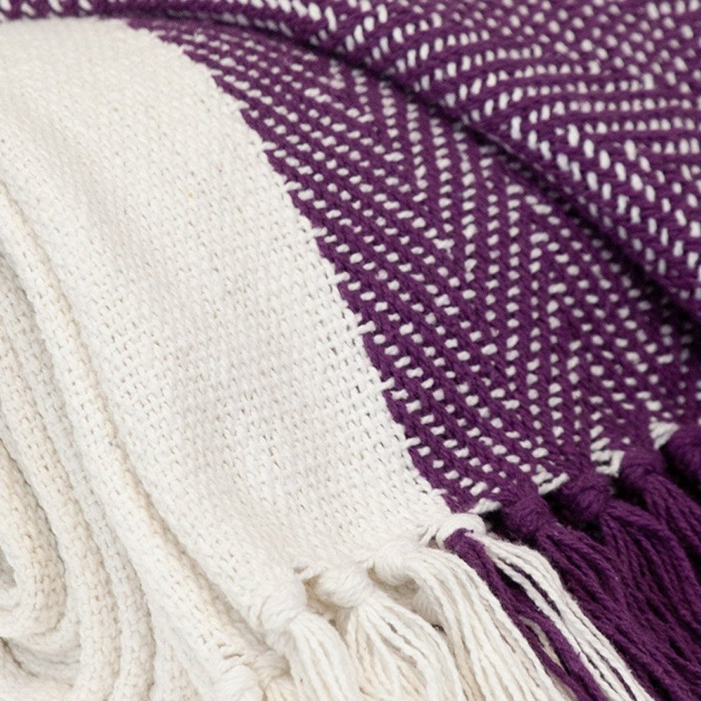 Purple woven cotton throw blanket from HomeRoots, showing soft textured fabric and intricate woven pattern.