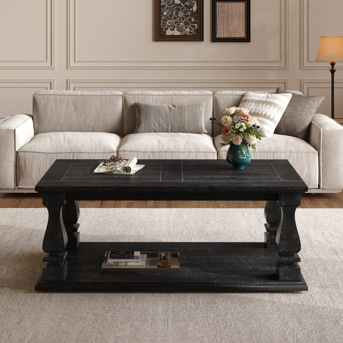 Weathered black farmhouse coffee table with heavy wood plank top, baluster legs, and storage shelf from Anthony & Home Atelier Collection.