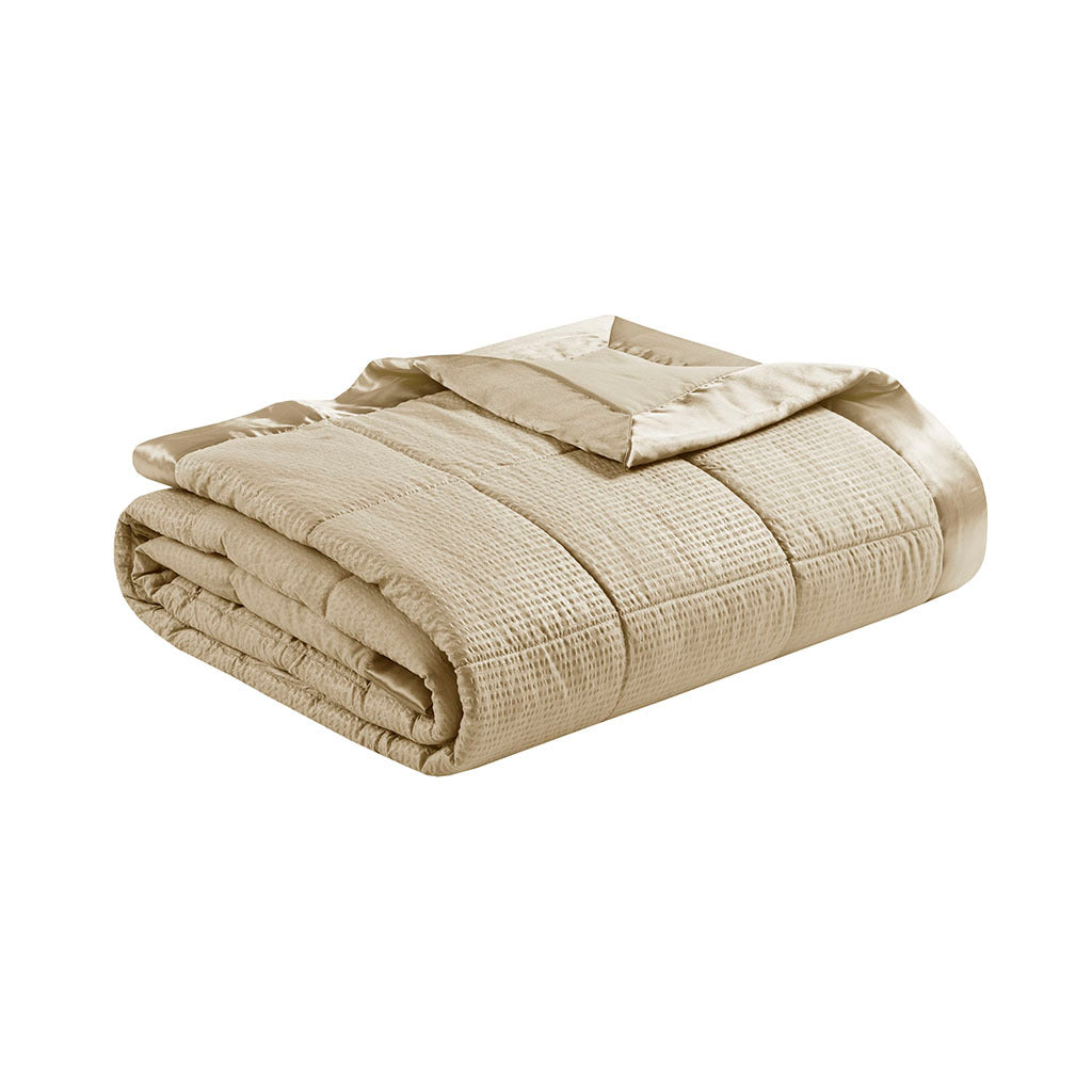 Taupe satin-trim oversized king blanket by Anthony & Home draped over a bed with plush pillows and cozy setting.