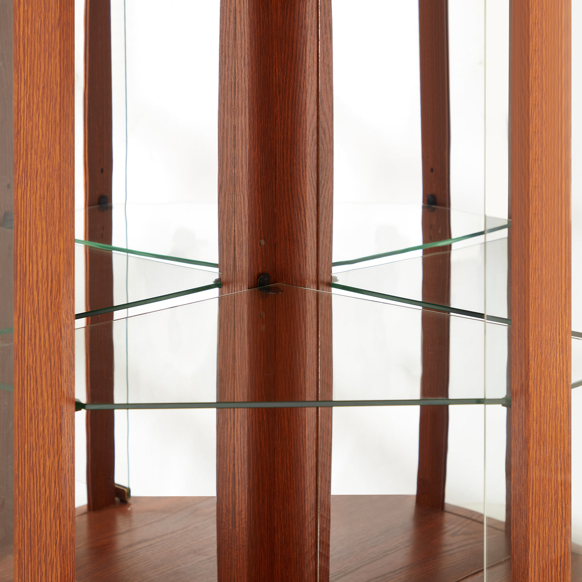 Dark oak corner lighted curio cabinet by Anthony & Home, showcasing glass doors and interior shelves for display.