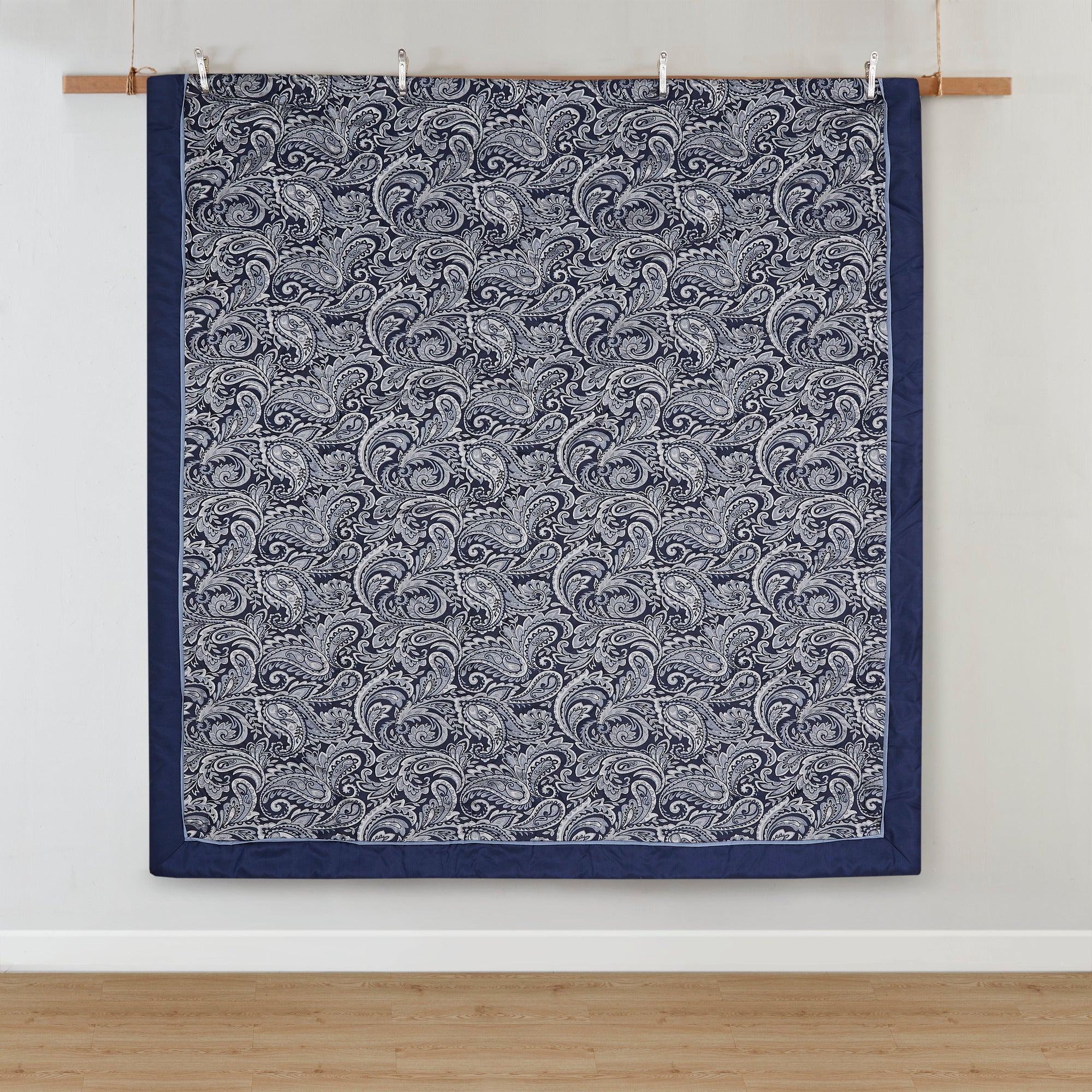 Navy jacquard cotton 12-piece Atelier Comforter Set by Anthony & Home displayed on a bed with pillows and bedding