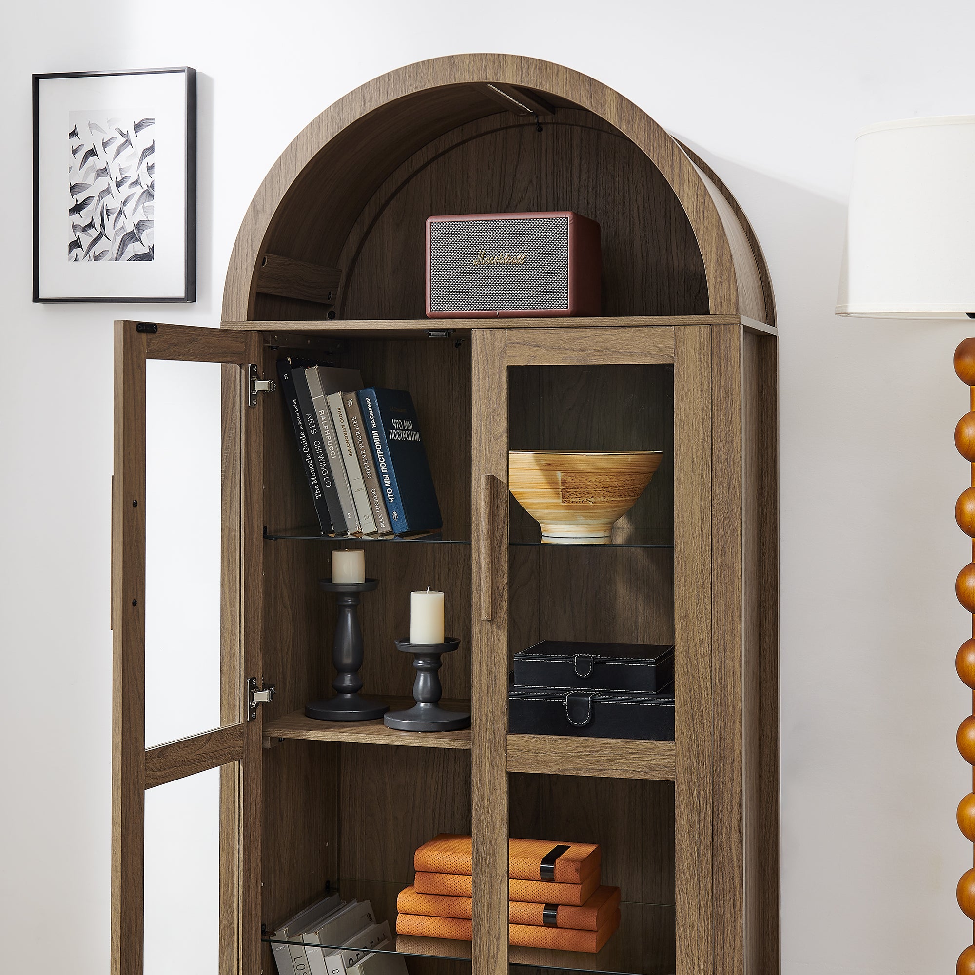 Arched walnut storage cabinet with built-in lamp from Anthony & Home, showcasing a stylish wooden design and elegant arch detail.