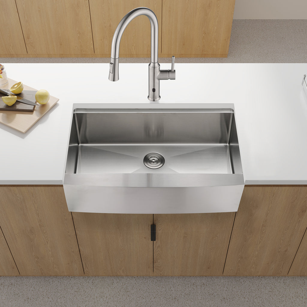 Anthony & Home stainless steel farmhouse apron kitchen sink with workstation, featuring deep basin and integrated accessories.