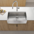 Anthony & Home stainless steel farmhouse apron kitchen sink with workstation, featuring deep basin and integrated accessories.