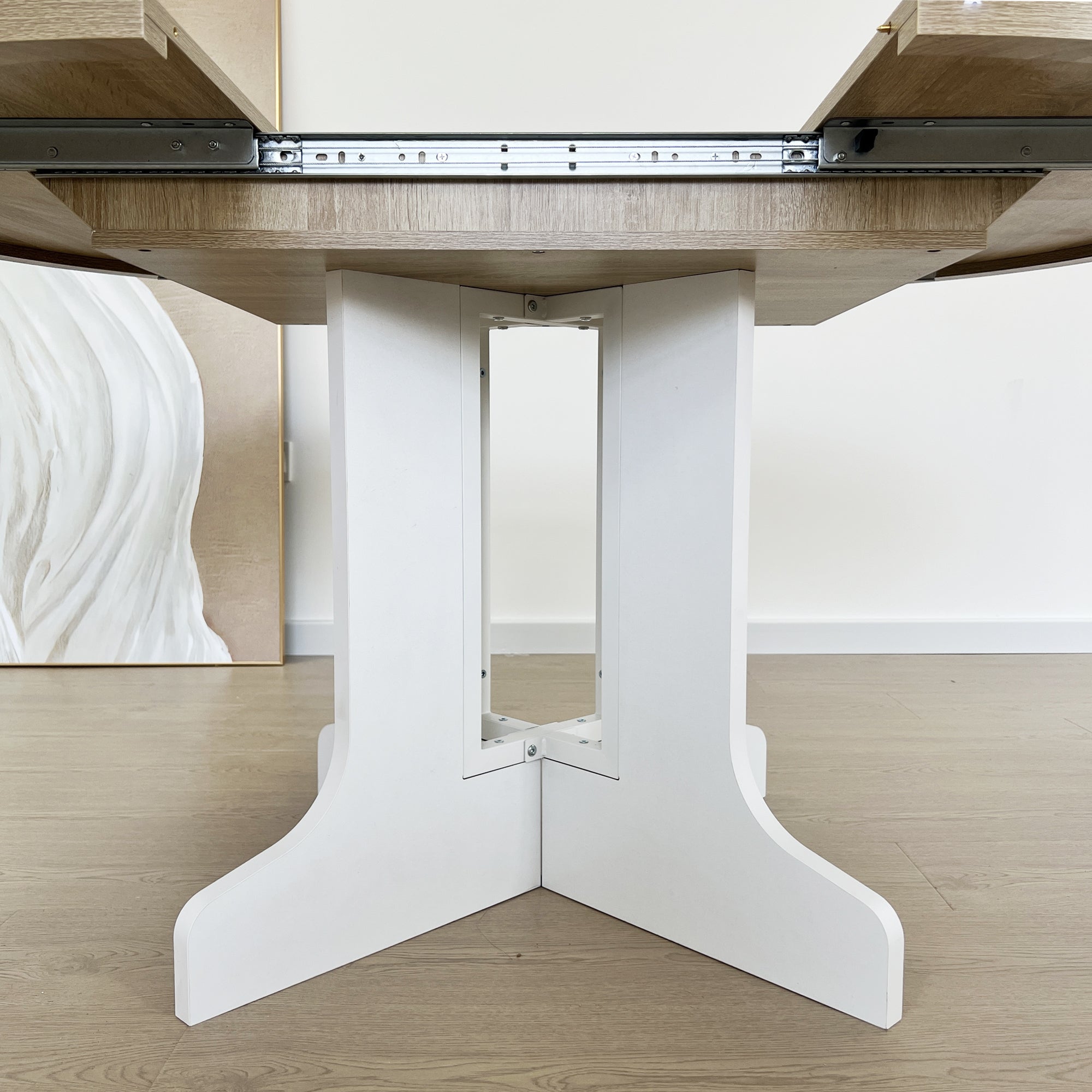 White Oak Edition oval dining table with expandable leaf by Anthony & Home, showcasing a sturdy wood surface and elegant design.