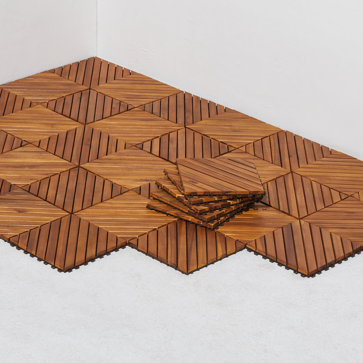 Dashiell 12-diagonal acacia wood interlocking deck tile showing a natural wood finish on a outdoor surface