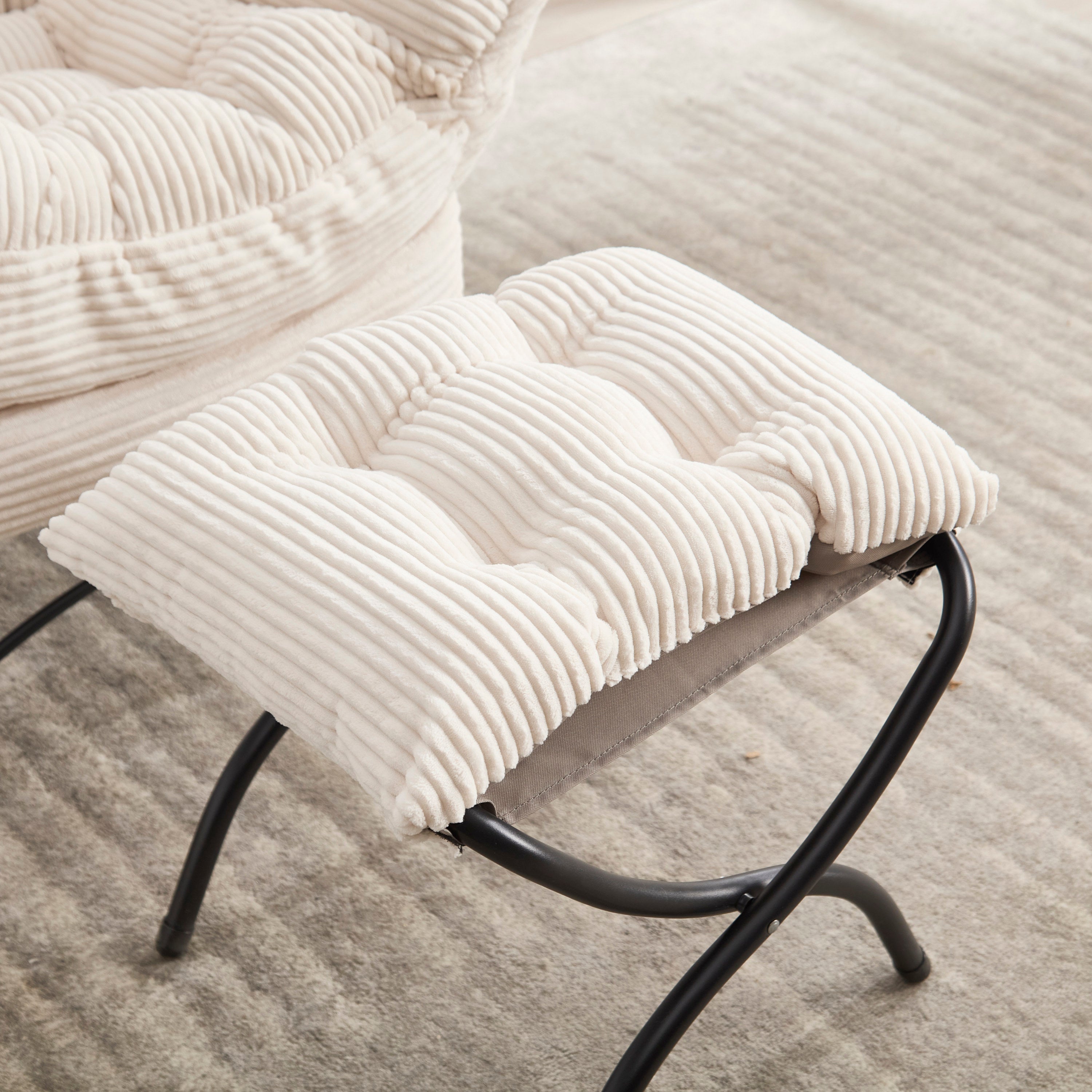 Ivory upholstered lounge chair with ottoman and side pocket, modern reading nook accent by Anthony & Home.