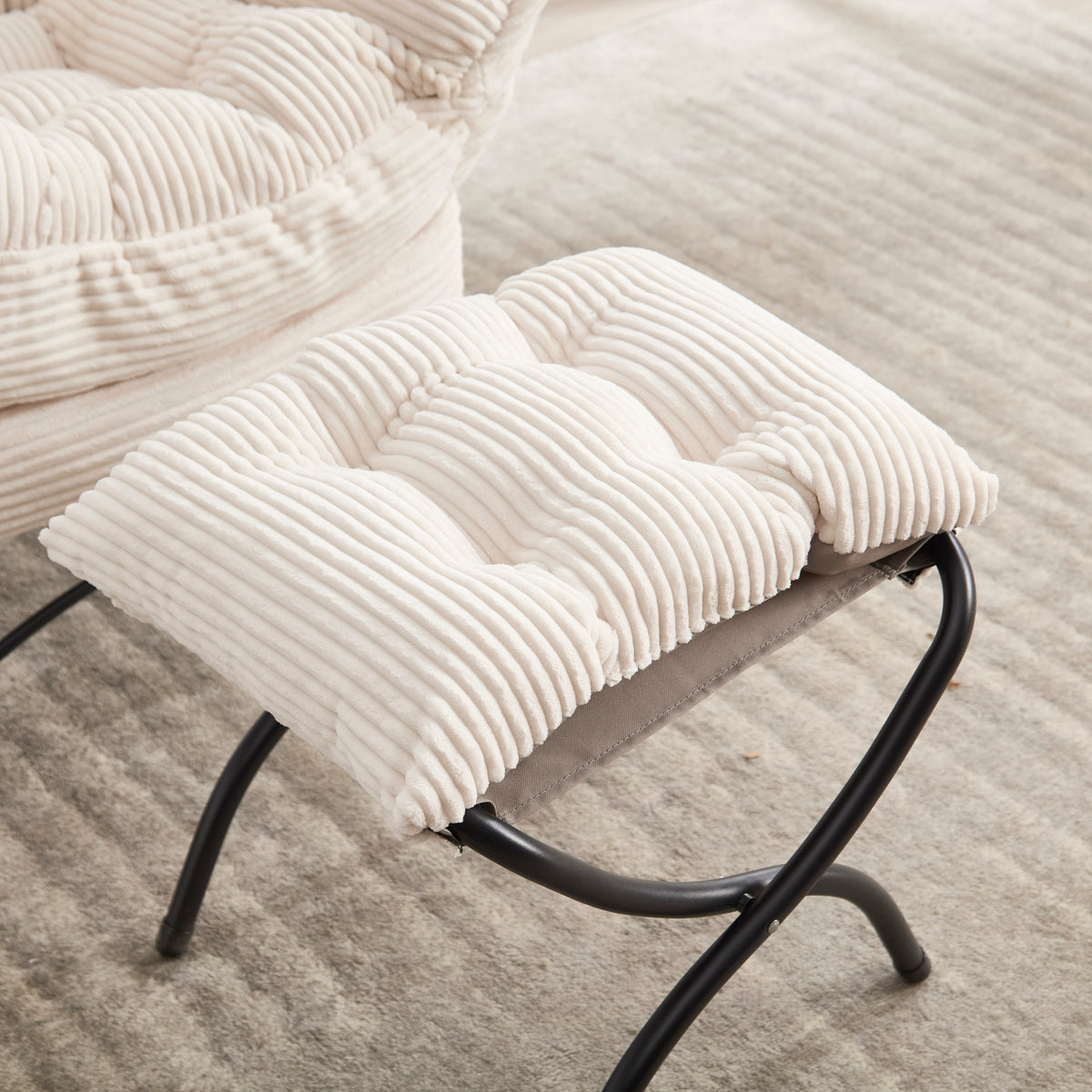 Ivory upholstered lounge chair with ottoman and side pocket, modern reading nook accent by Anthony & Home.