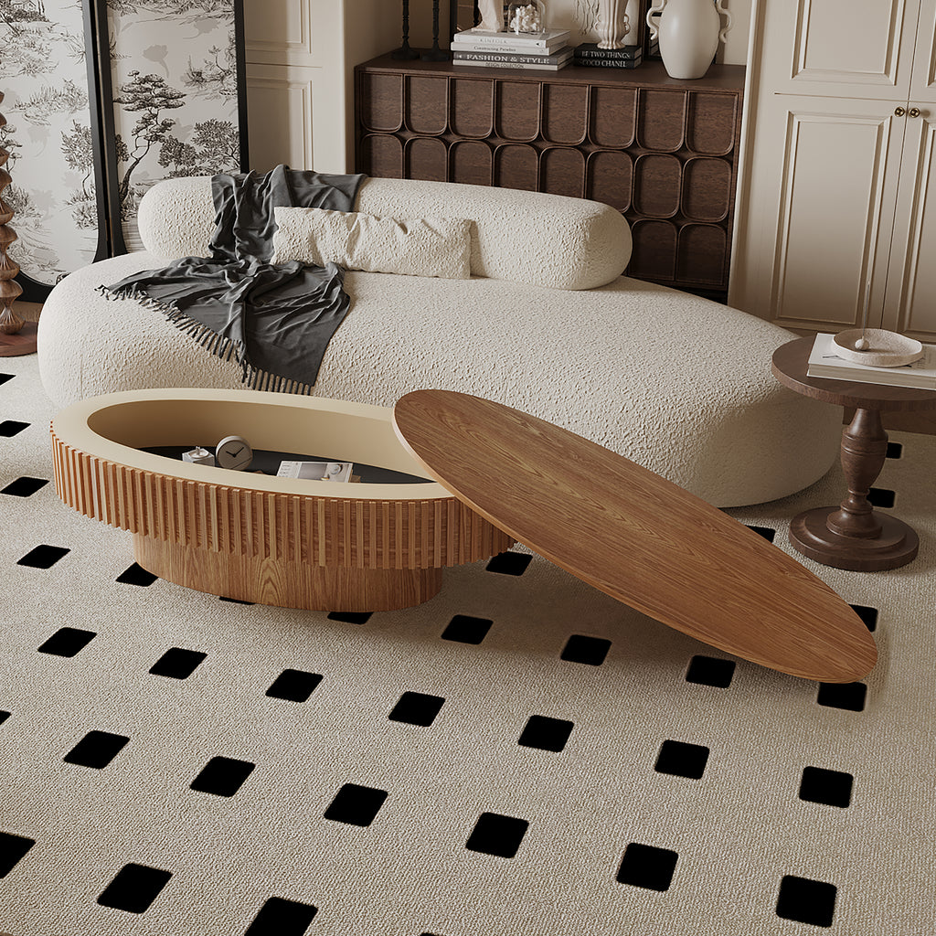Oval coffee table with storage in solid wood veneer, Anthony & Home Atelier design, showcasing a sleek modern living room setup.