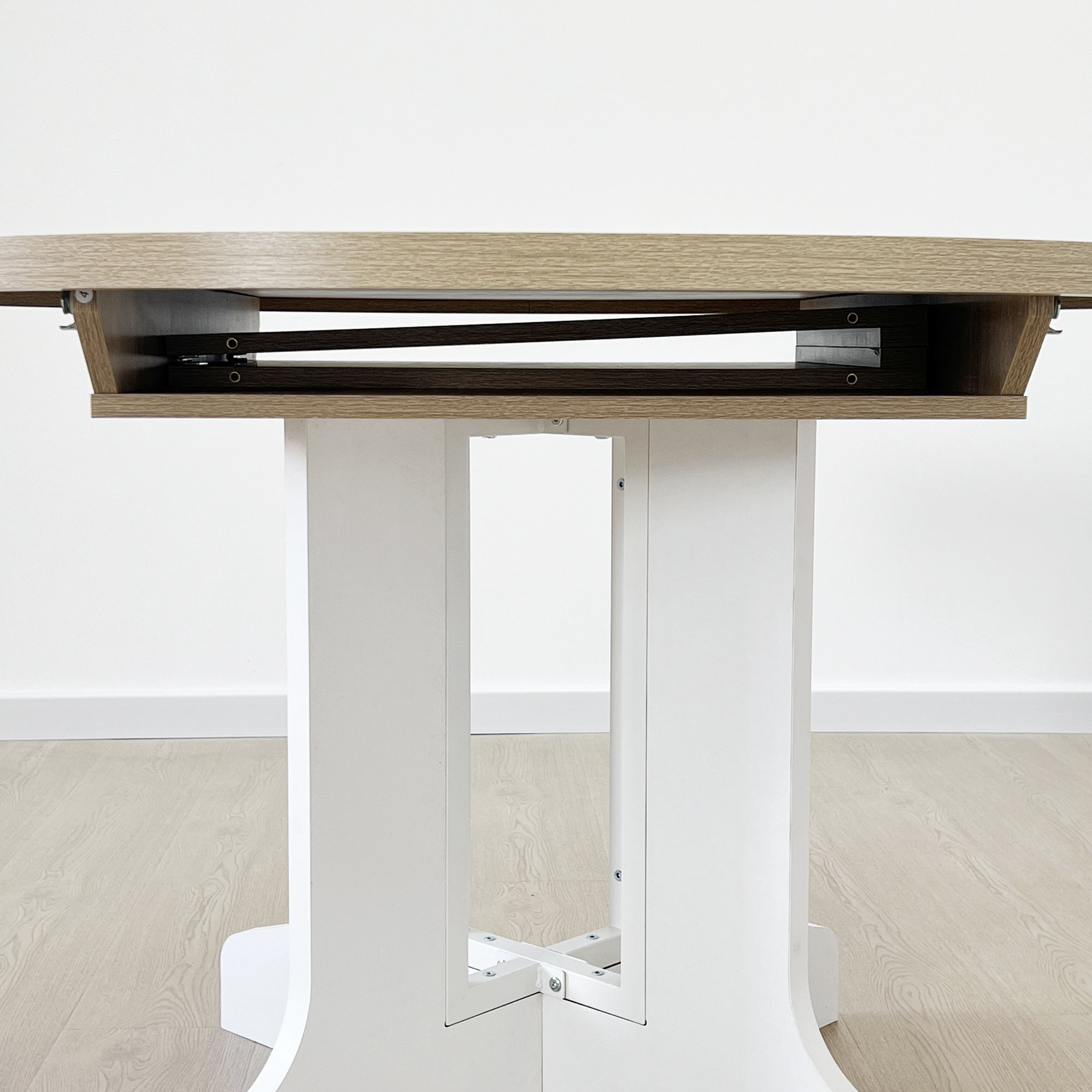 White Oak Edition oval dining table with expandable leaf by Anthony & Home, showcasing a sleek wooden surface and sturdy design.