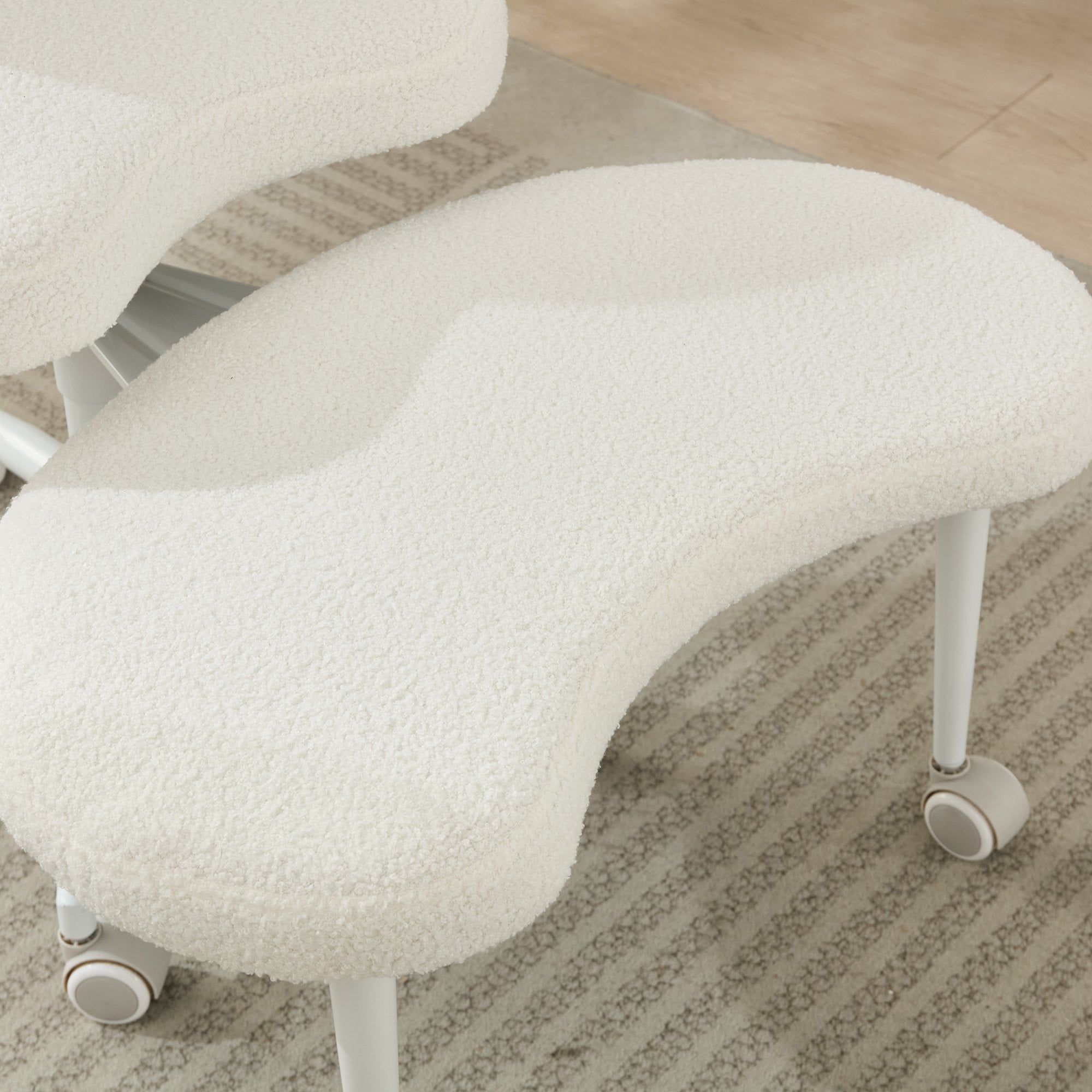 Ivory cross-legged meditation chair with wheels by Anthony & Home, designed for comfortable seated meditation practice.