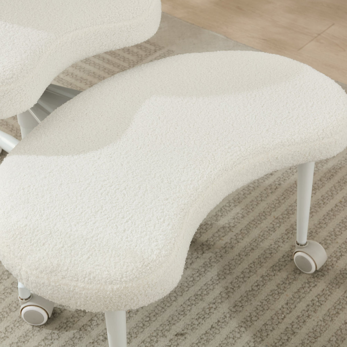 Ivory cross-legged meditation chair with wheels by Anthony & Home, designed for comfortable seated meditation practice.