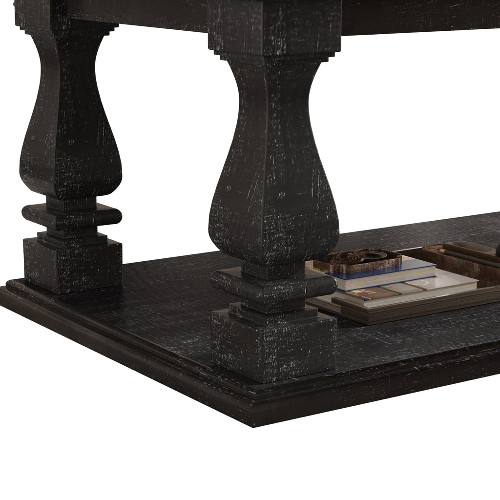 Weathered black farmhouse coffee table with heavy plank top, baluster legs, and storage shelf from Anthony & Home Atelier Collection.