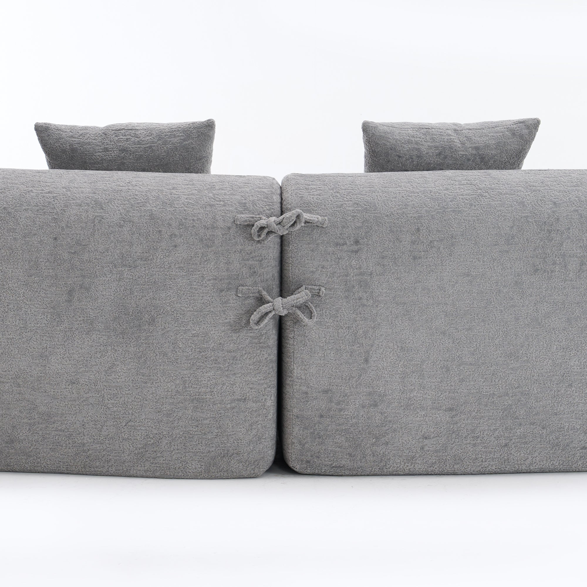 Grey curved modular sofa in chenille fabric from Anthony & Home, showcasing a modern, plush sectional with comfortable cushions.