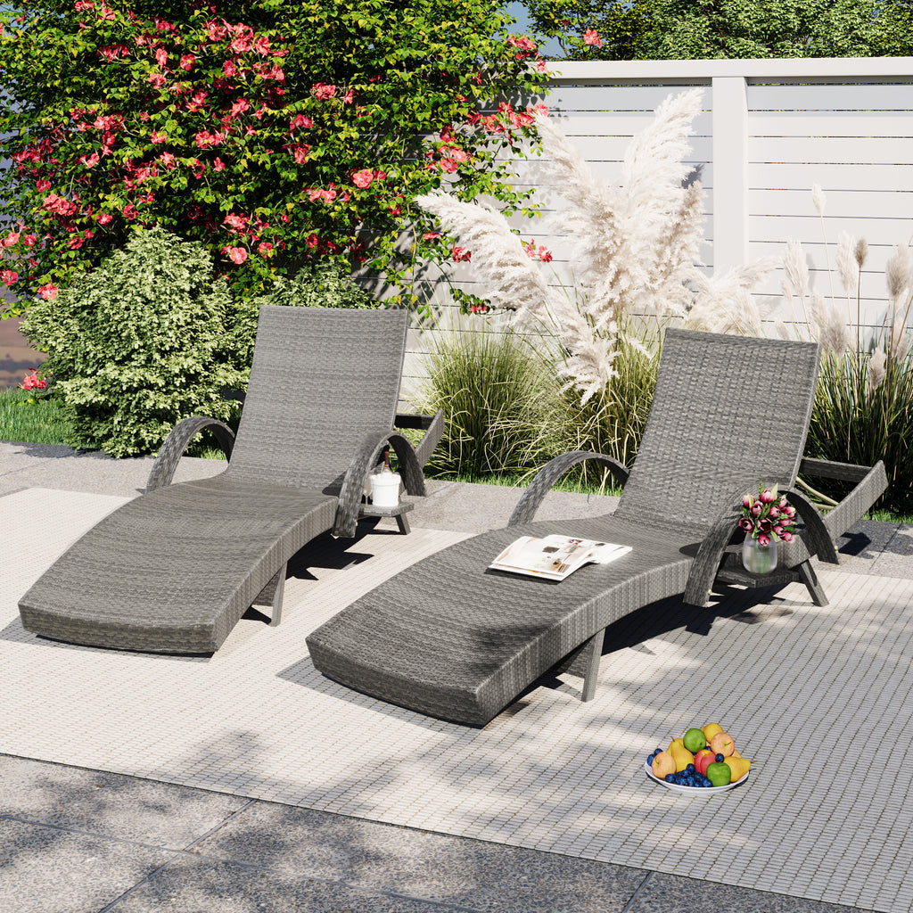 Outdoor wicker chaise lounge set with ergonomic wave design in grey, perfect for relaxing in a stylish garden space.