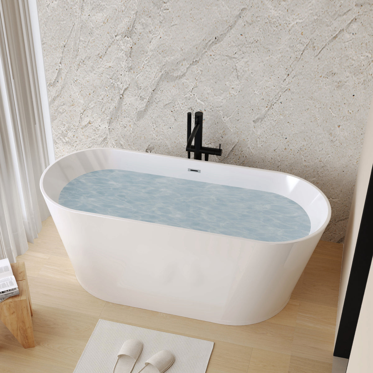Glossy white acrylic freestanding soaking tub by Anthony & Home with ergonomic design, shown from a side view.