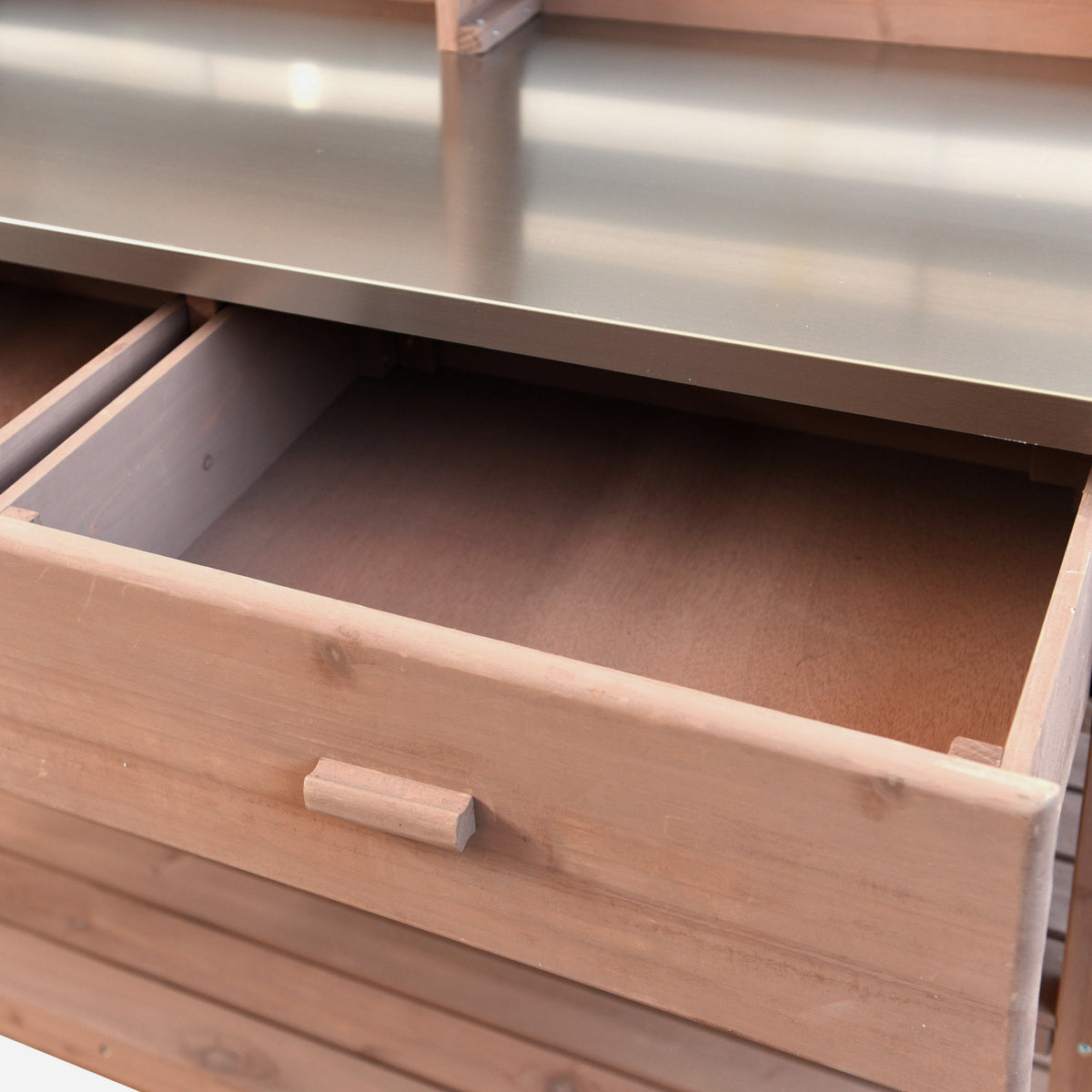 Anthony & Home Signature outdoor potting bench with stainless steel top, featuring a sturdy wooden frame and gardening workspace