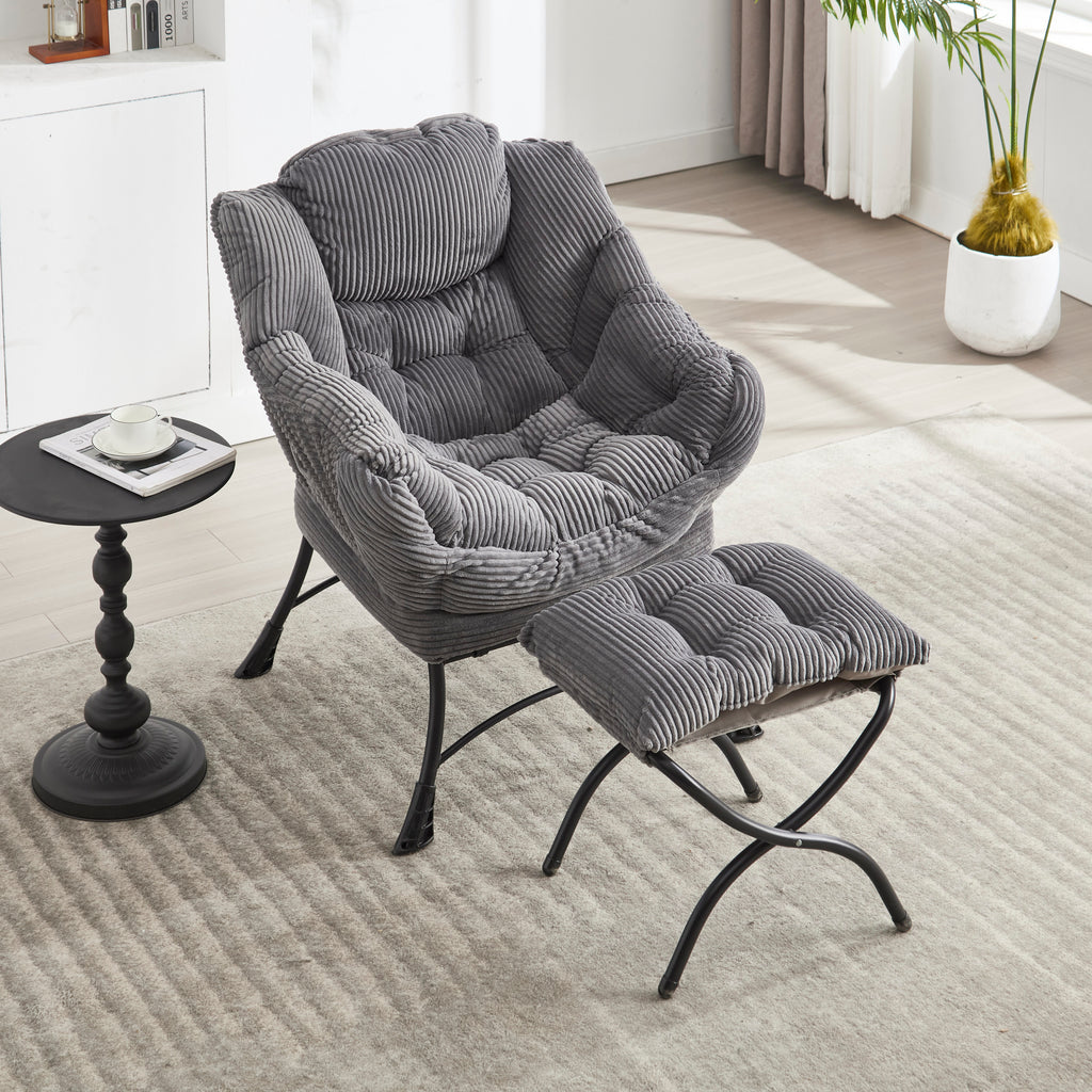 Grey upholstered lounge chair with matching ottoman and armrests, modern design from Anthony & Home.