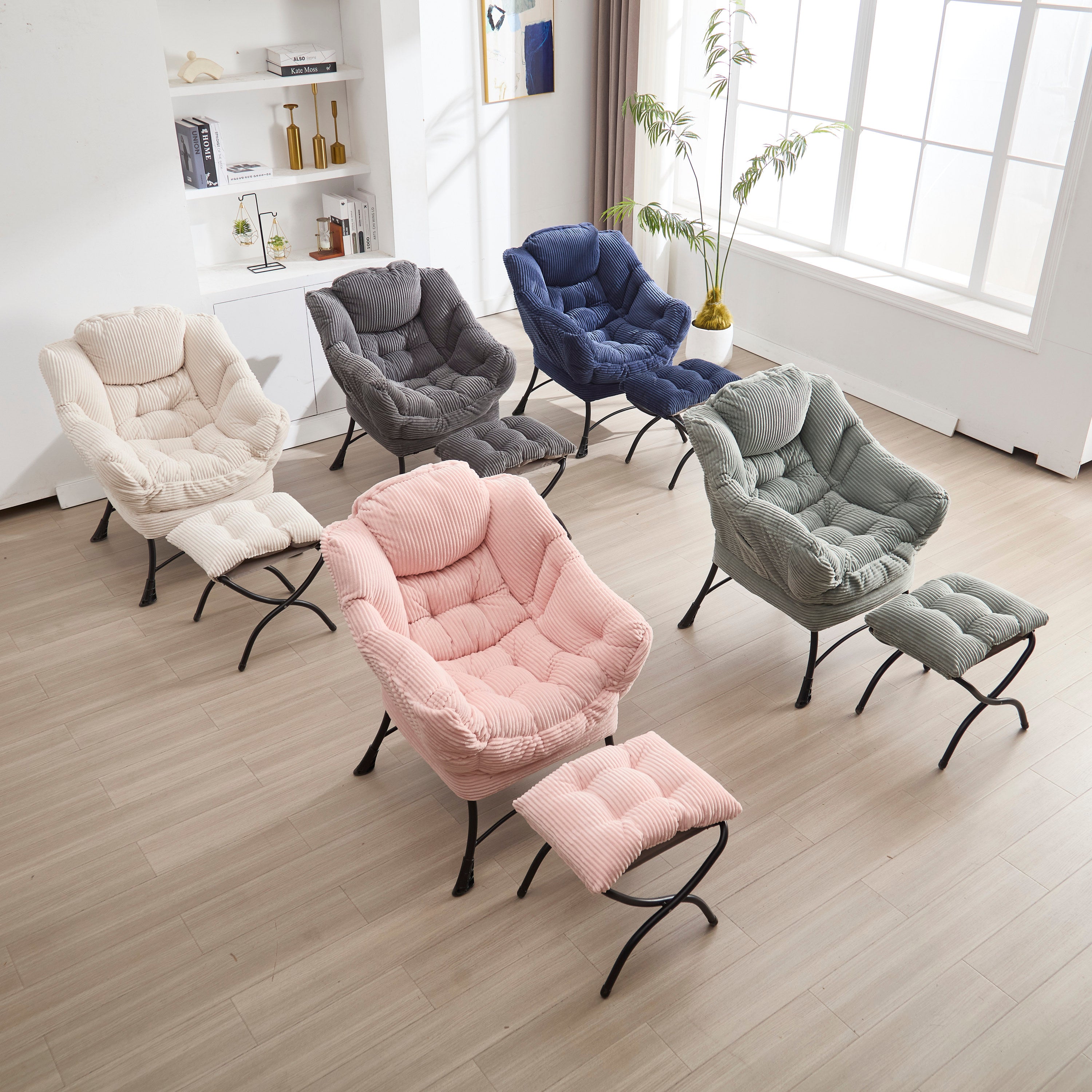 Grey upholstered lounge chair with matching ottoman and armrests, modern design by Anthony & Home in a cozy living room setting.