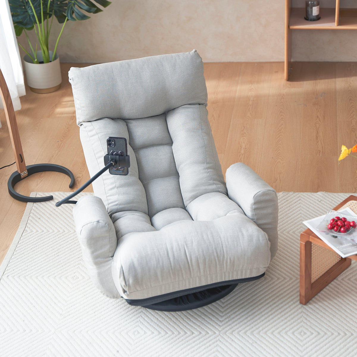 Gray Anthony & Home swivel lounge chair with 360-degree rotation, showcasing a modern, plush seat with a rounded design.