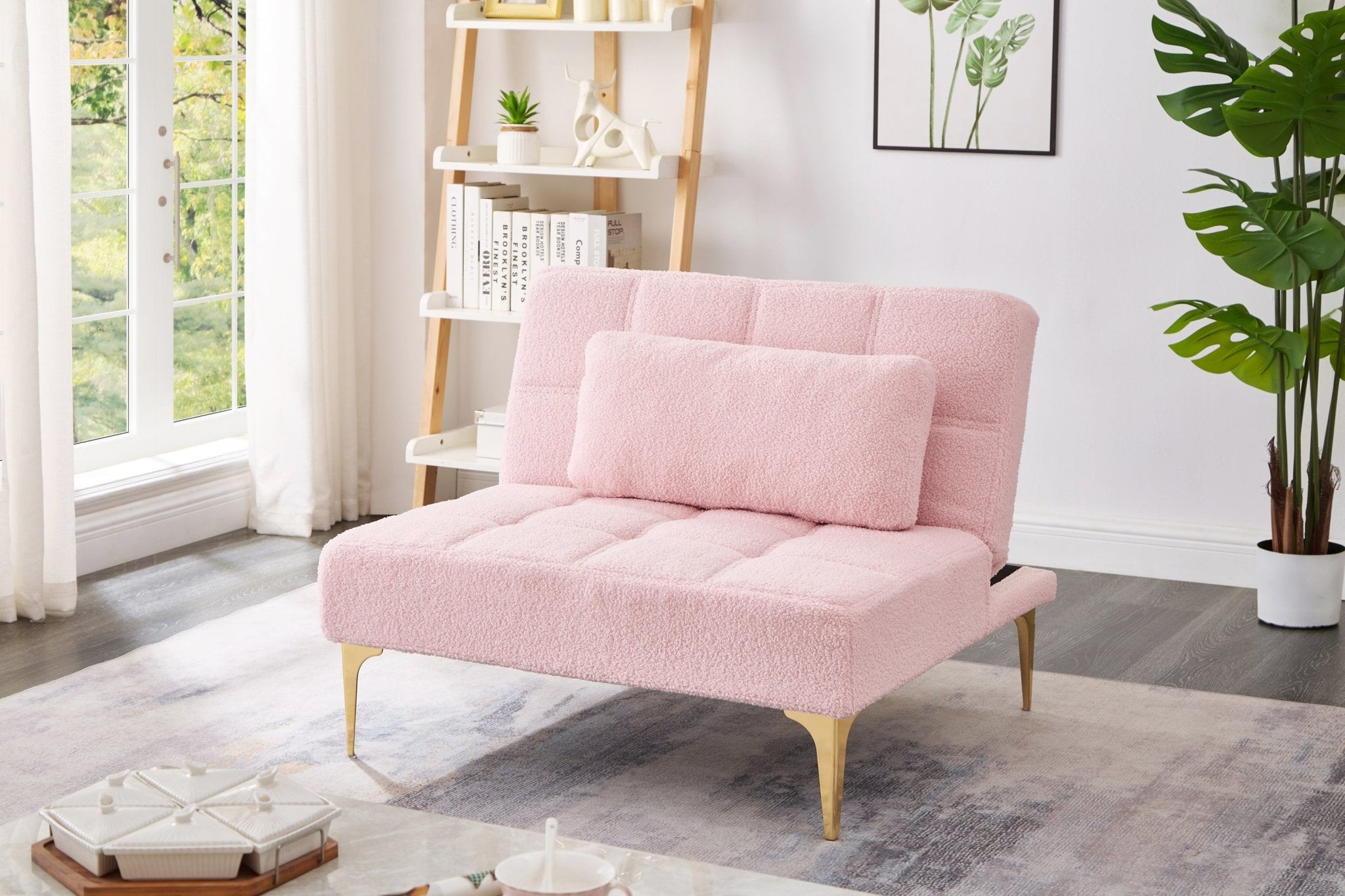 Limited edition Anthony & Home convertible sofa bed in pink teddy fabric with gold metal legs, showcasing its plush upholstery and modern design.