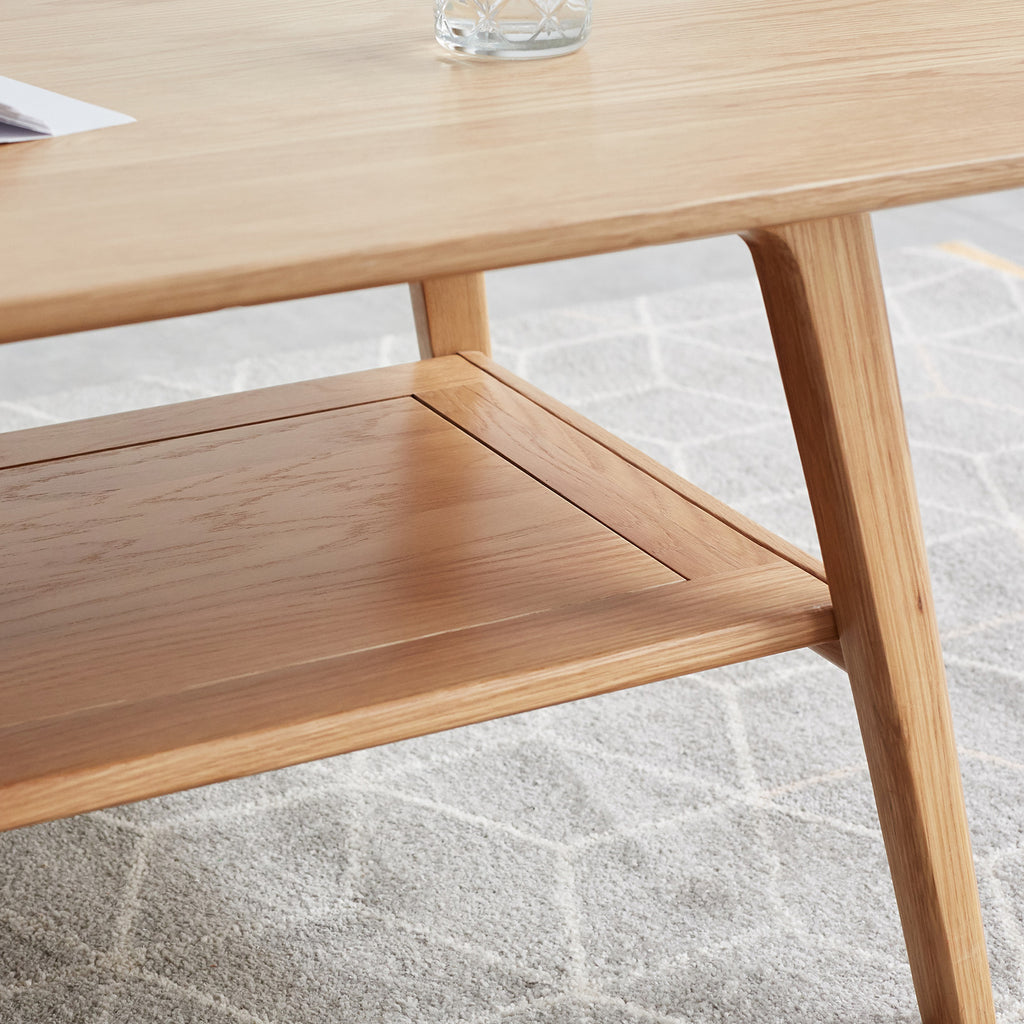 Natural oak coffee table with storage shelf from Anthony & Home's Atelier Collection, showcasing a sleek, timeless design.