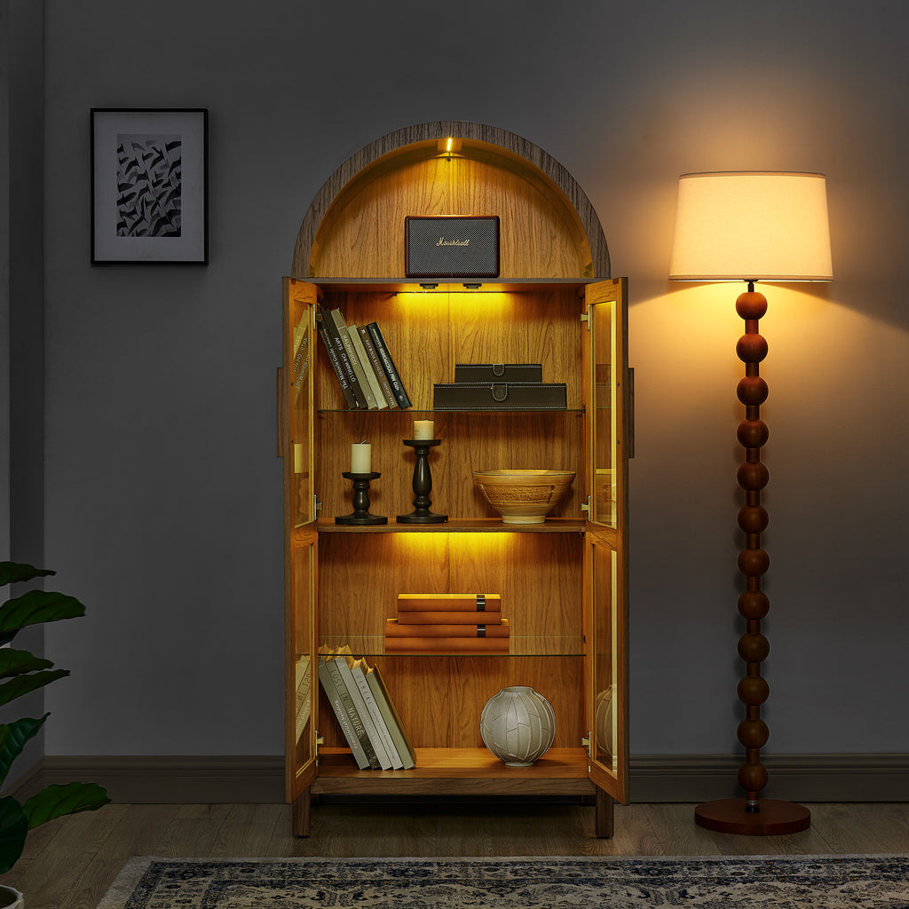 Walnut arched storage cabinet with built-in lamp from Anthony & Home, showcasing a stylish wooden design and functional storage space.