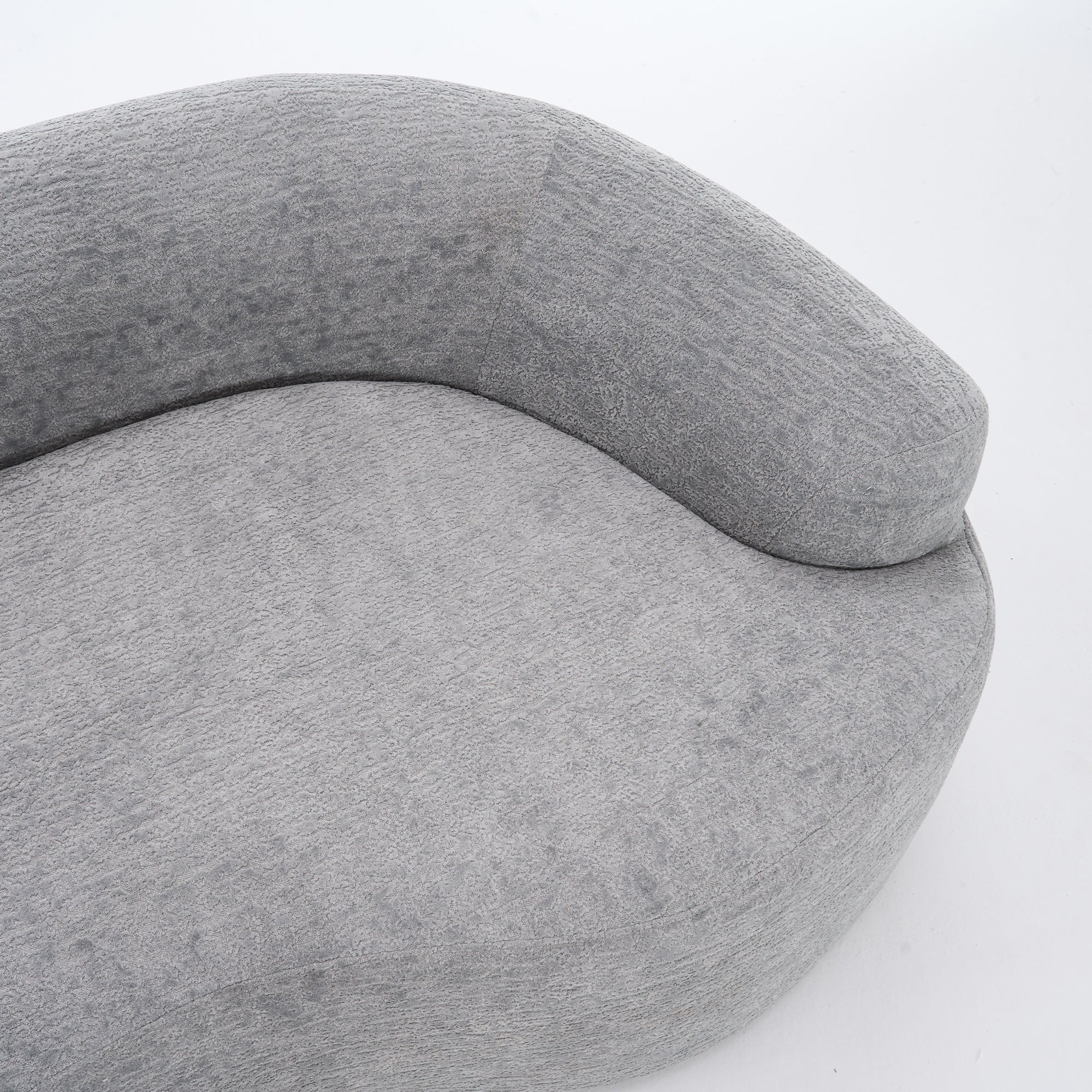 Grey curved modular sofa by Anthony & Home in soft chenille fabric, showcasing its luxurious, contemporary design.