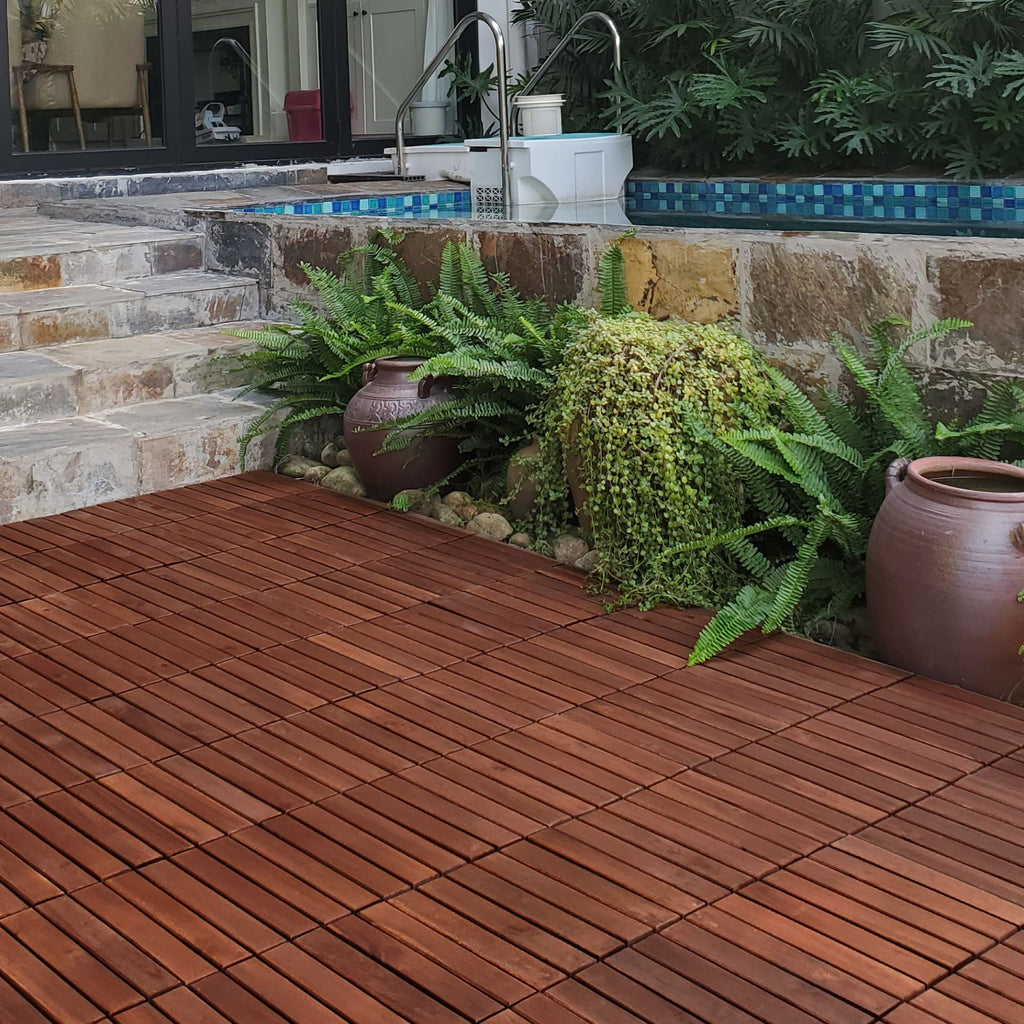 Anthony & Home Acacia Studio Interlocking Deck Tiles in striped 12-inch design, showing the textured wooden surface and interlocking edges.