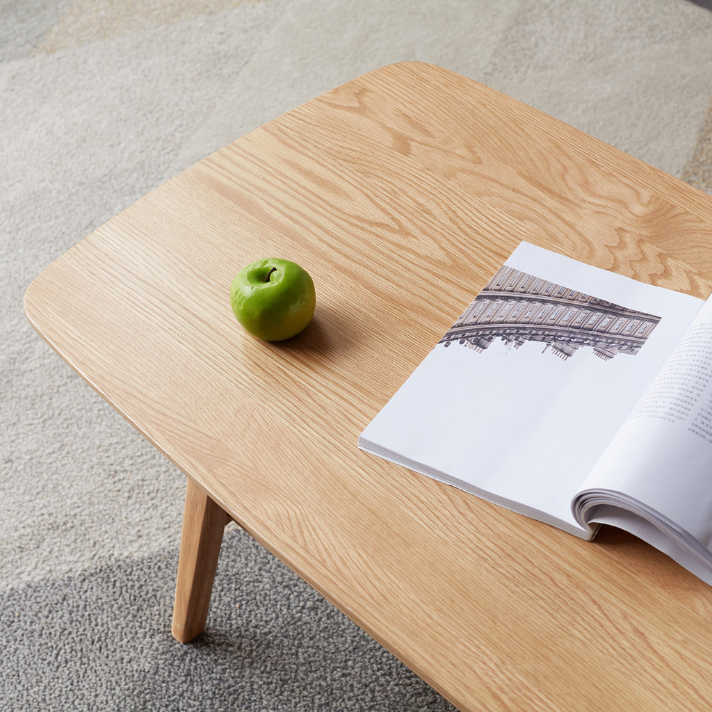 Natural oak coffee table with storage shelf from Anthony & Home's Atelier Collection, showcasing a sleek, timeless design.