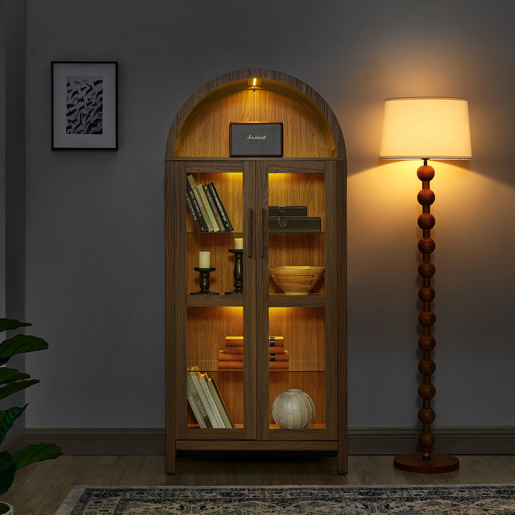 Walnut arched storage cabinet with built-in lamp by Anthony & Home, showcasing elegant wood design and spacious interior.