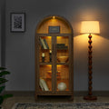 Walnut arched storage cabinet with built-in lamp by Anthony & Home, showcasing elegant wood design and spacious interior.