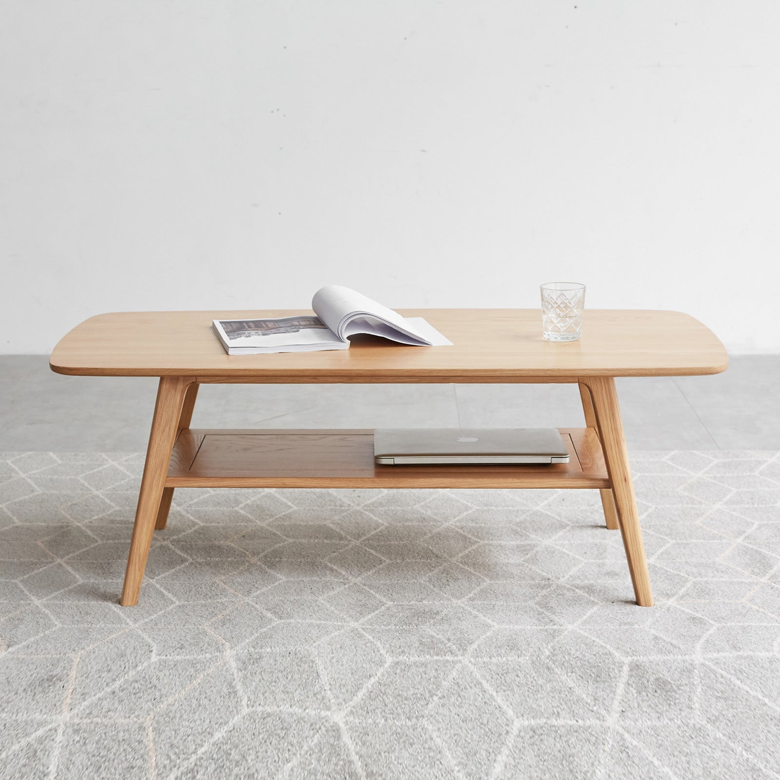 Natural oak coffee table with storage shelf from Anthony & Home's Atelier Collection, showcasing sleek wood finish and modern design.