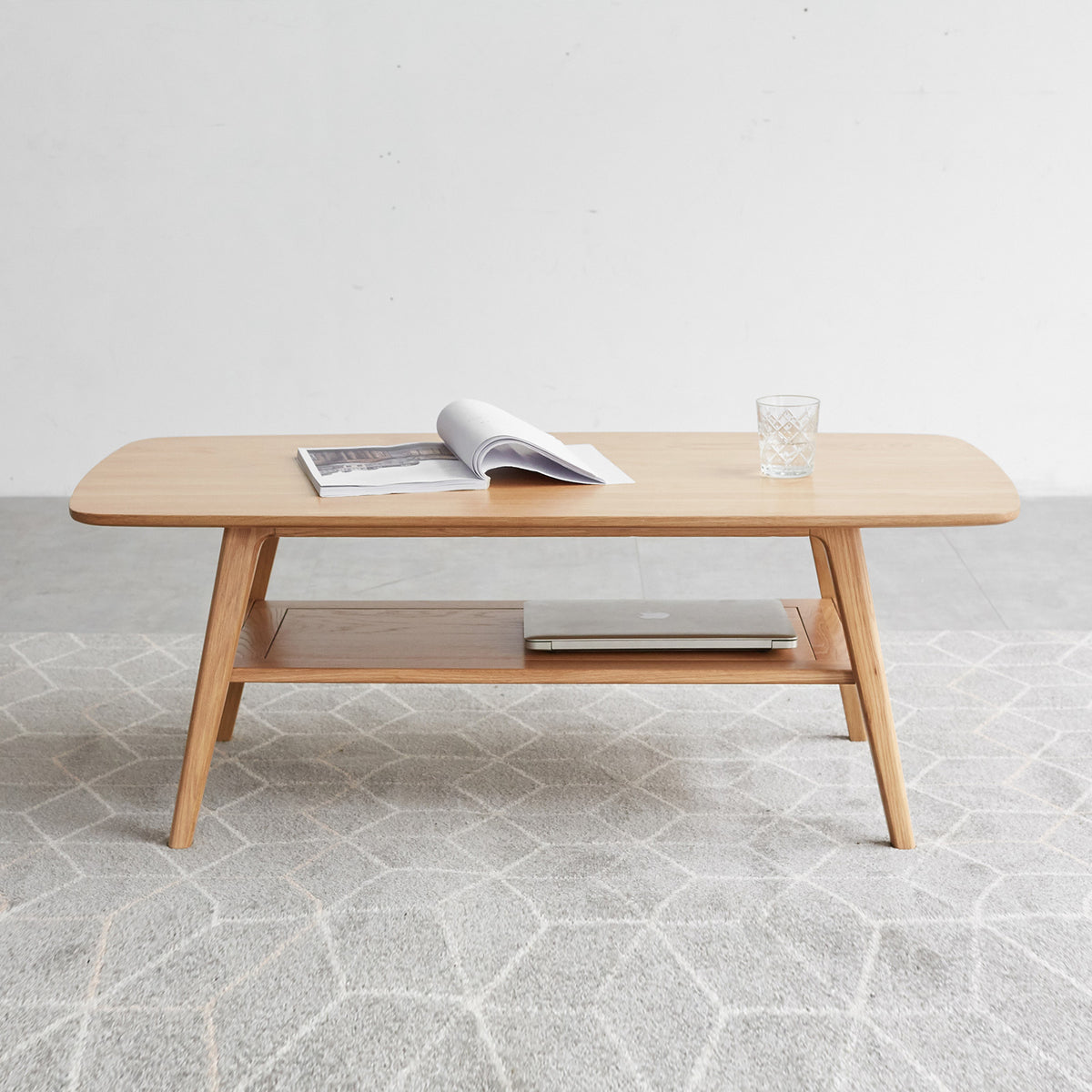 Natural oak coffee table with storage shelf from Anthony & Home's Atelier Collection, showcasing sleek wood finish and modern design.