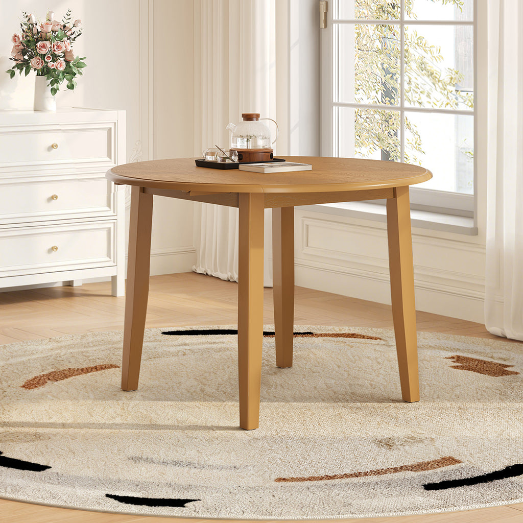 Extendable round solid wood dining table by Anthony & Home, showcasing a sturdy, natural finish and smooth extendable mechanism.