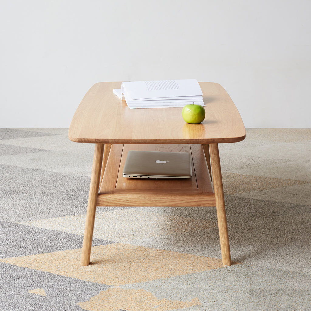 Natural oak coffee table with storage shelf from Anthony & Home's Atelier Collection, showcasing a sleek, timeless design.