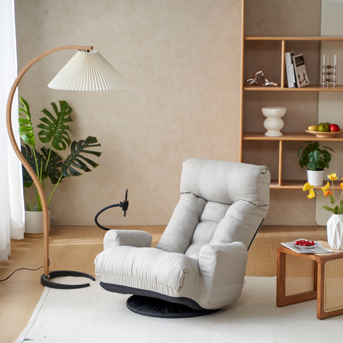 Gray Anthony & Home swivel lounge chair with 360-degree rotation, featuring a modern design and comfortable seating.