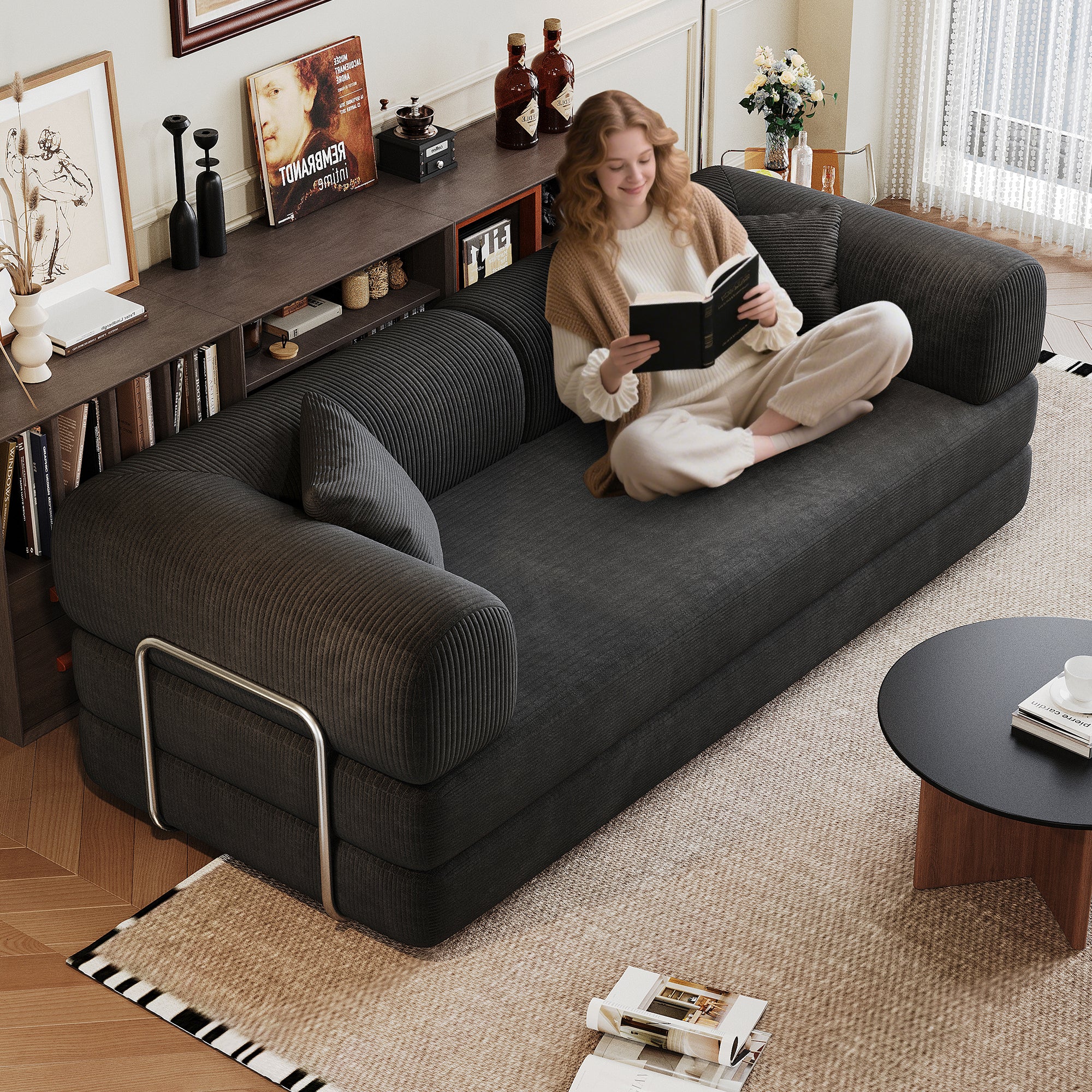 Black corduroy convertible sofa bed from Anthony & Home's Atelier Collection, showcasing its sleek design and versatile functionality.
