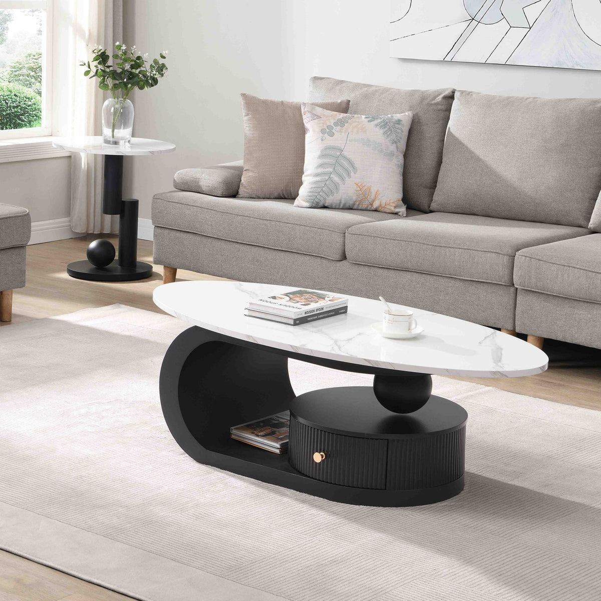 Set of three oval and round Anthony & Home Studio Nesting Coffee Tables with sleek wooden surfaces and modern design.