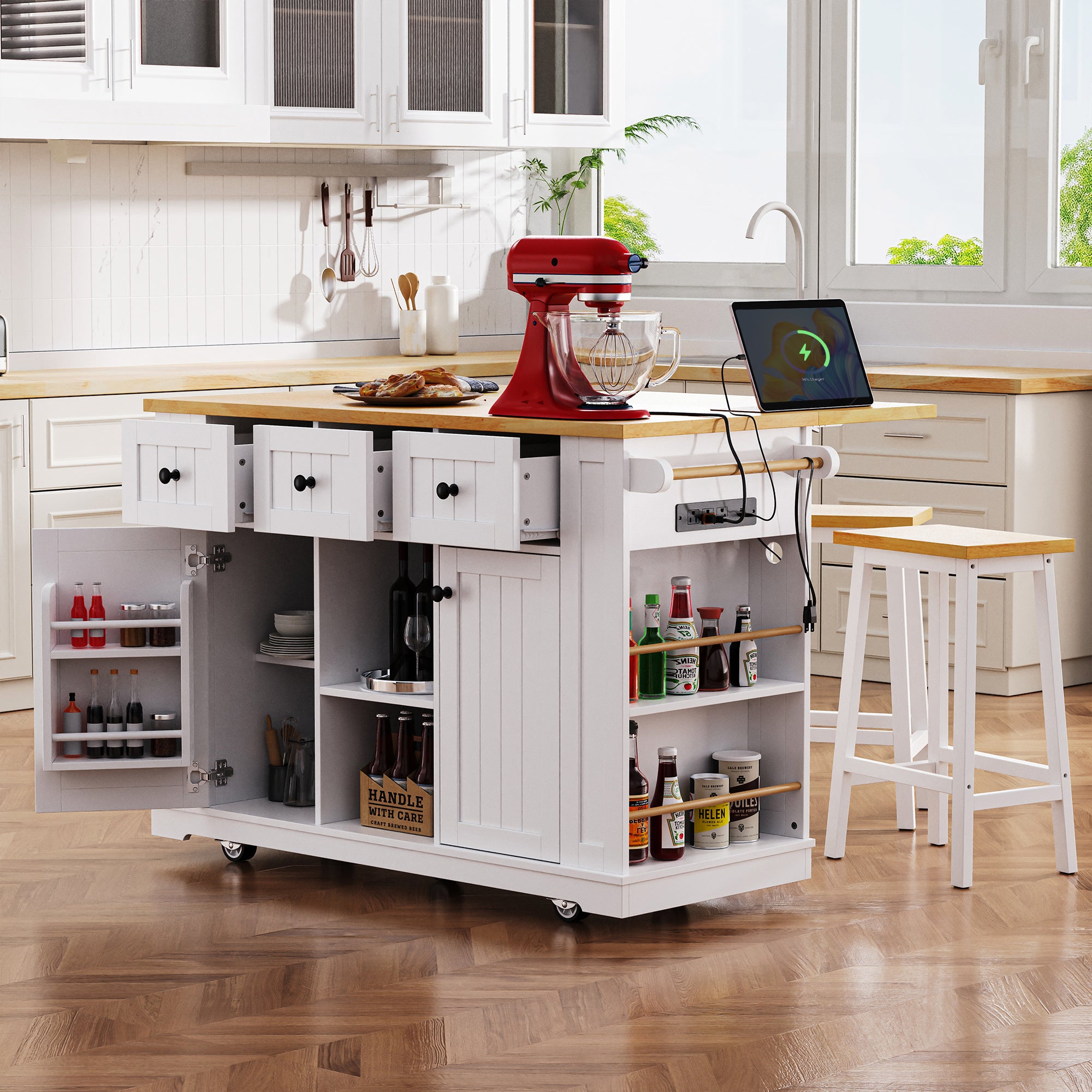 White Anthony & Home Studio MDF kitchen island with drop leaf, bar stools, power outlet, and storage cart.