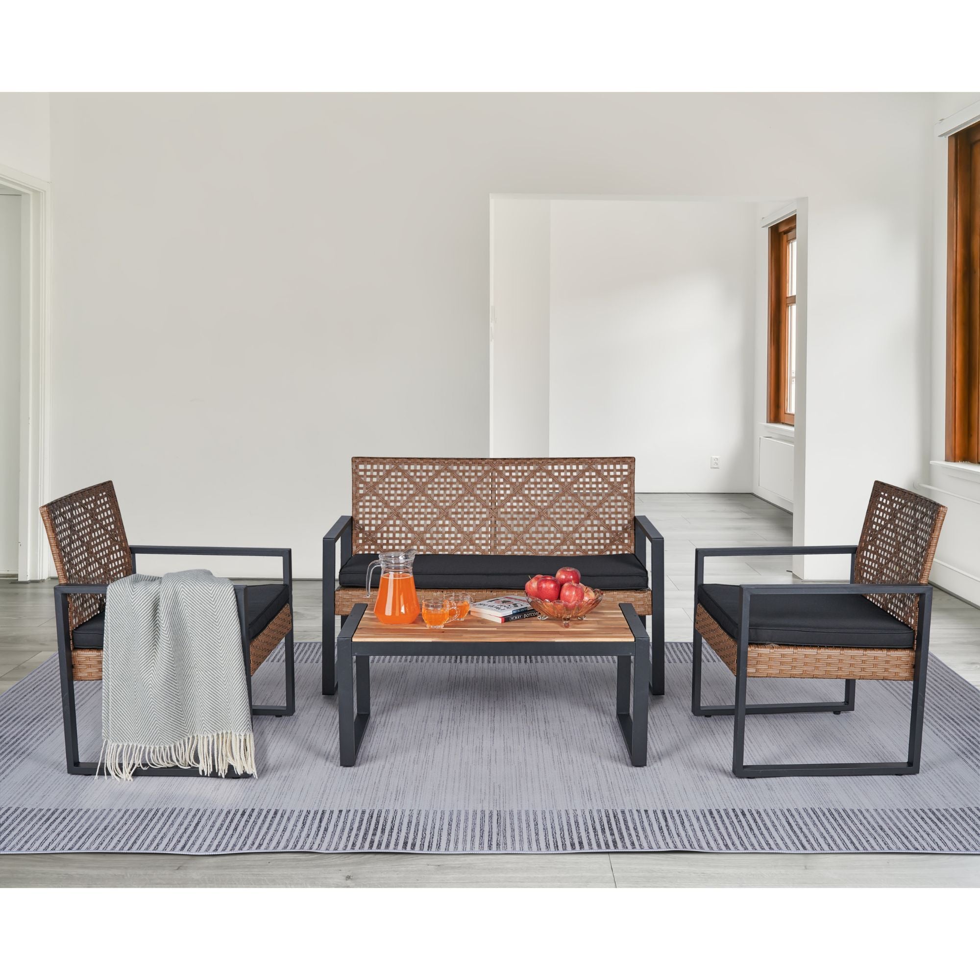 Acacia wood outdoor 4-piece studio dining set by Anthony & Home with table and four chairs on patio