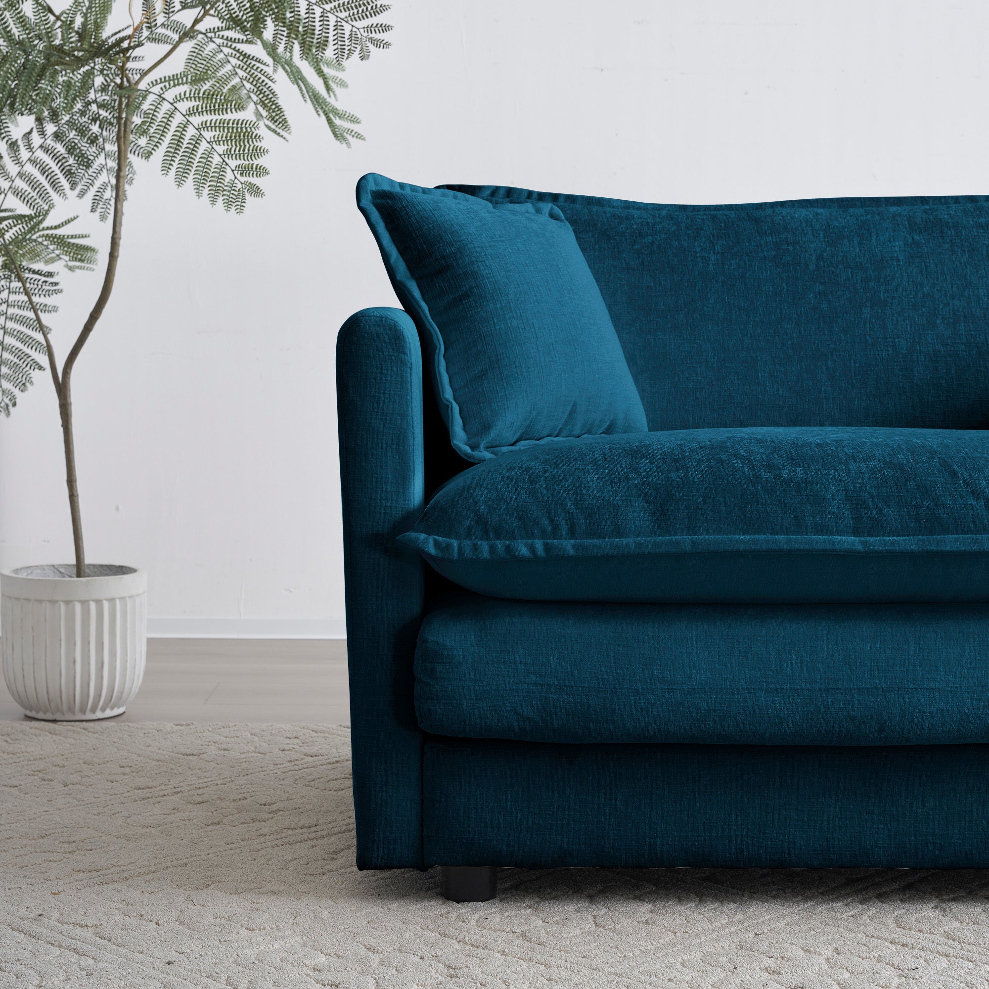 Blue chenille modular L-shaped sofa with reversible ottoman by Anthony & Home, shown with plush cushions and modern design.