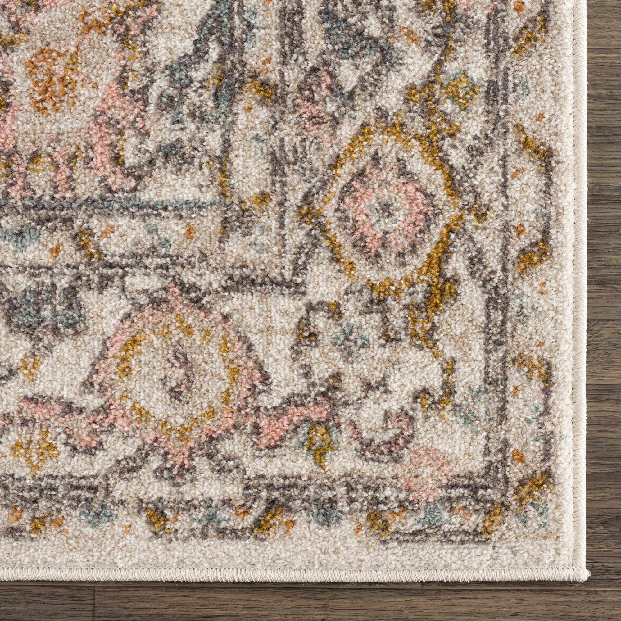 Corner view of the Herstmonceux Area Rug by Boutique Rugs, showcasing intricate patterns and soft textured surface.