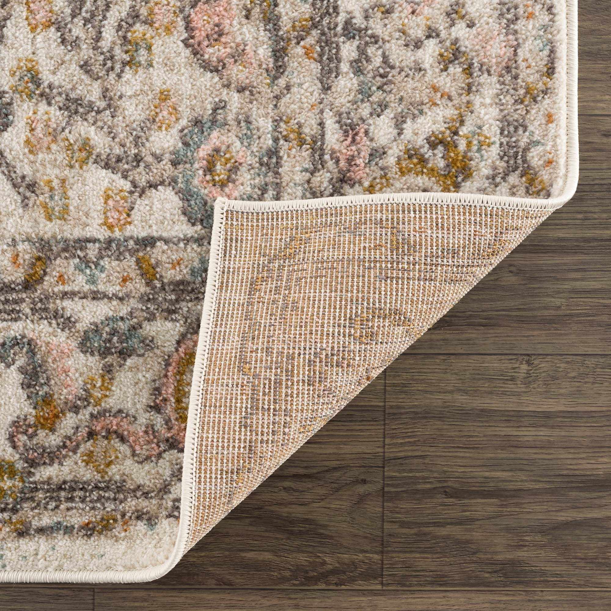 Folded Herstmonceux area rug by Boutique Rugs, showcasing a detailed, textured design in soft, neutral tones suitable for living spaces.