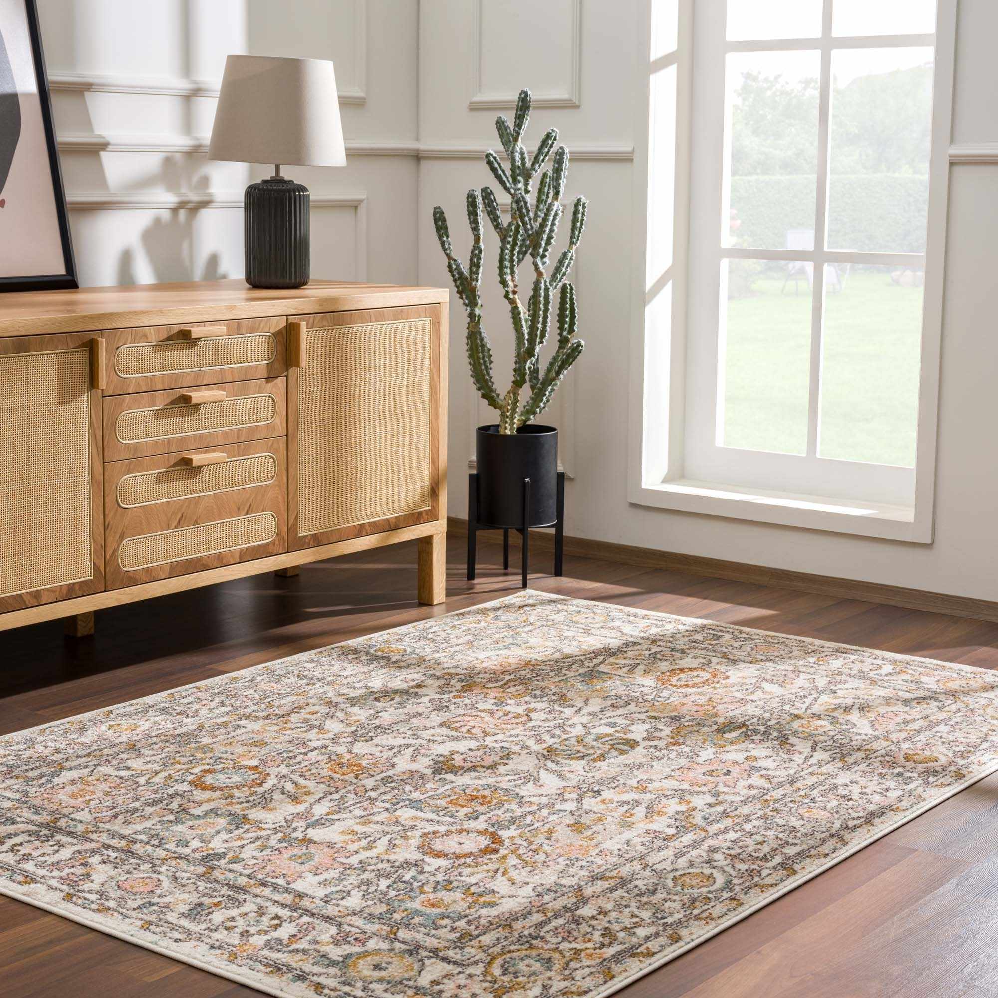 Herstmonceux area rug by Boutique Rugs displayed in a cozy room setting with intricate patterns and soft, neutral colors.